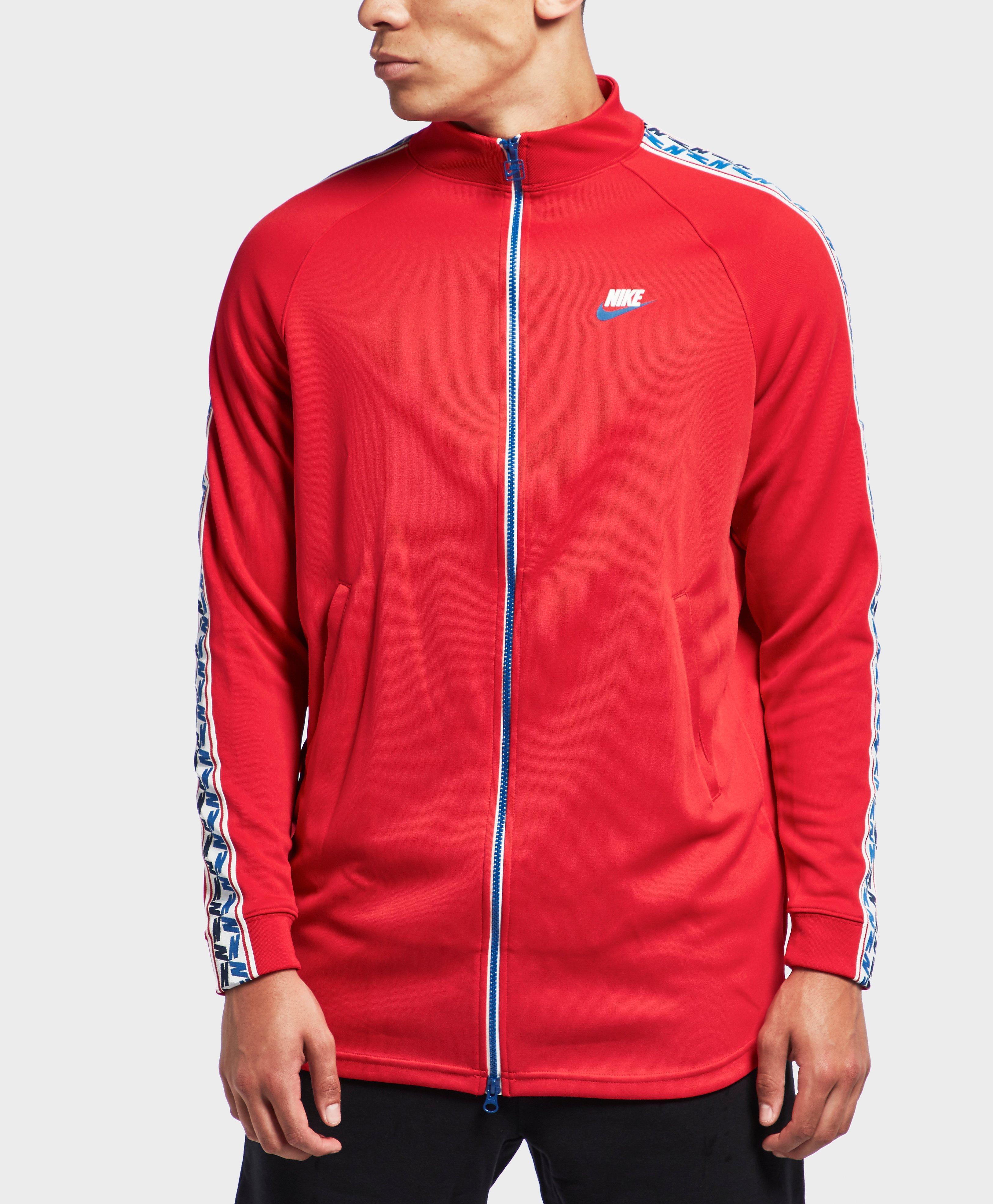 nike arch taped track top
