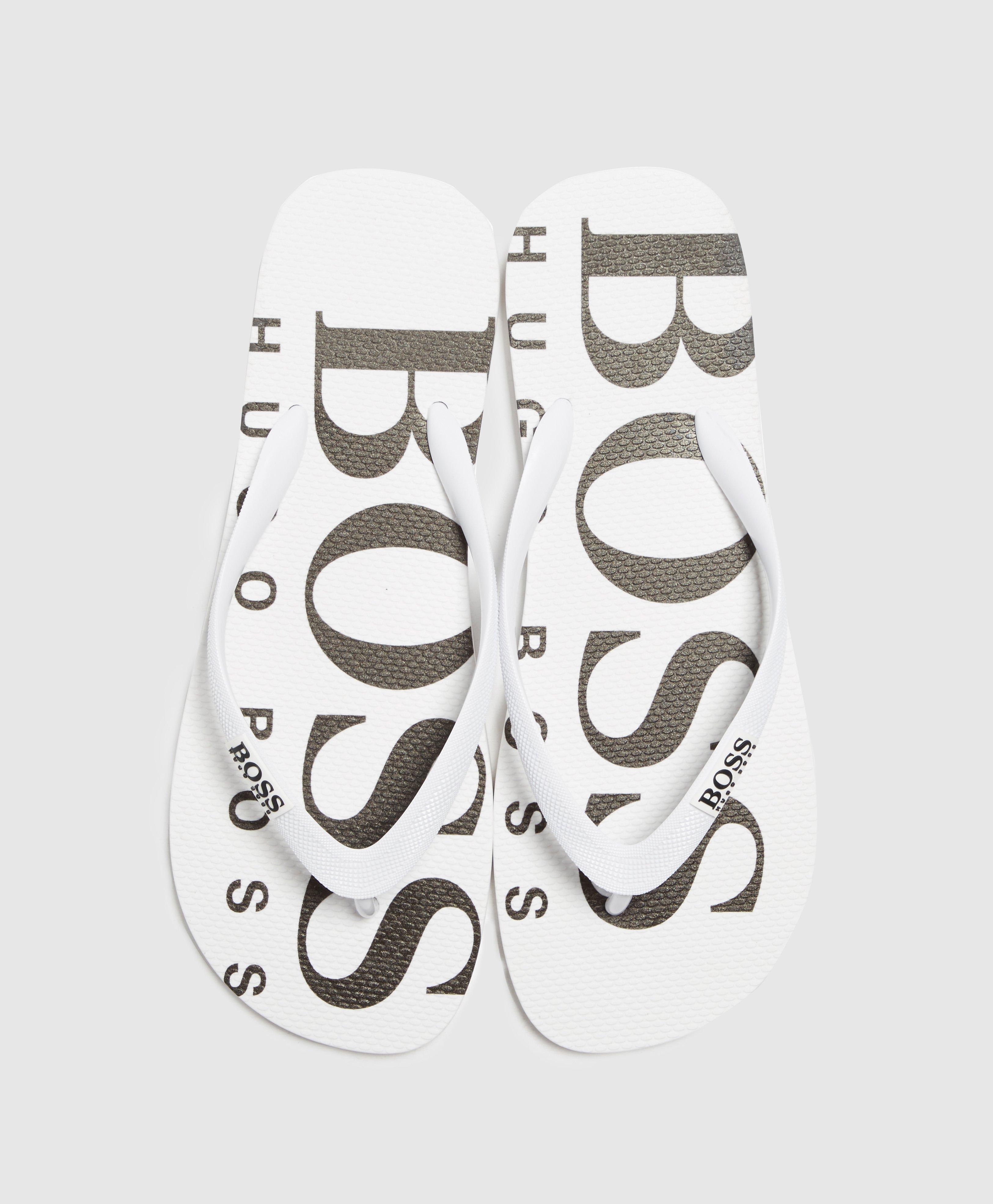 white hugo boss flip flops