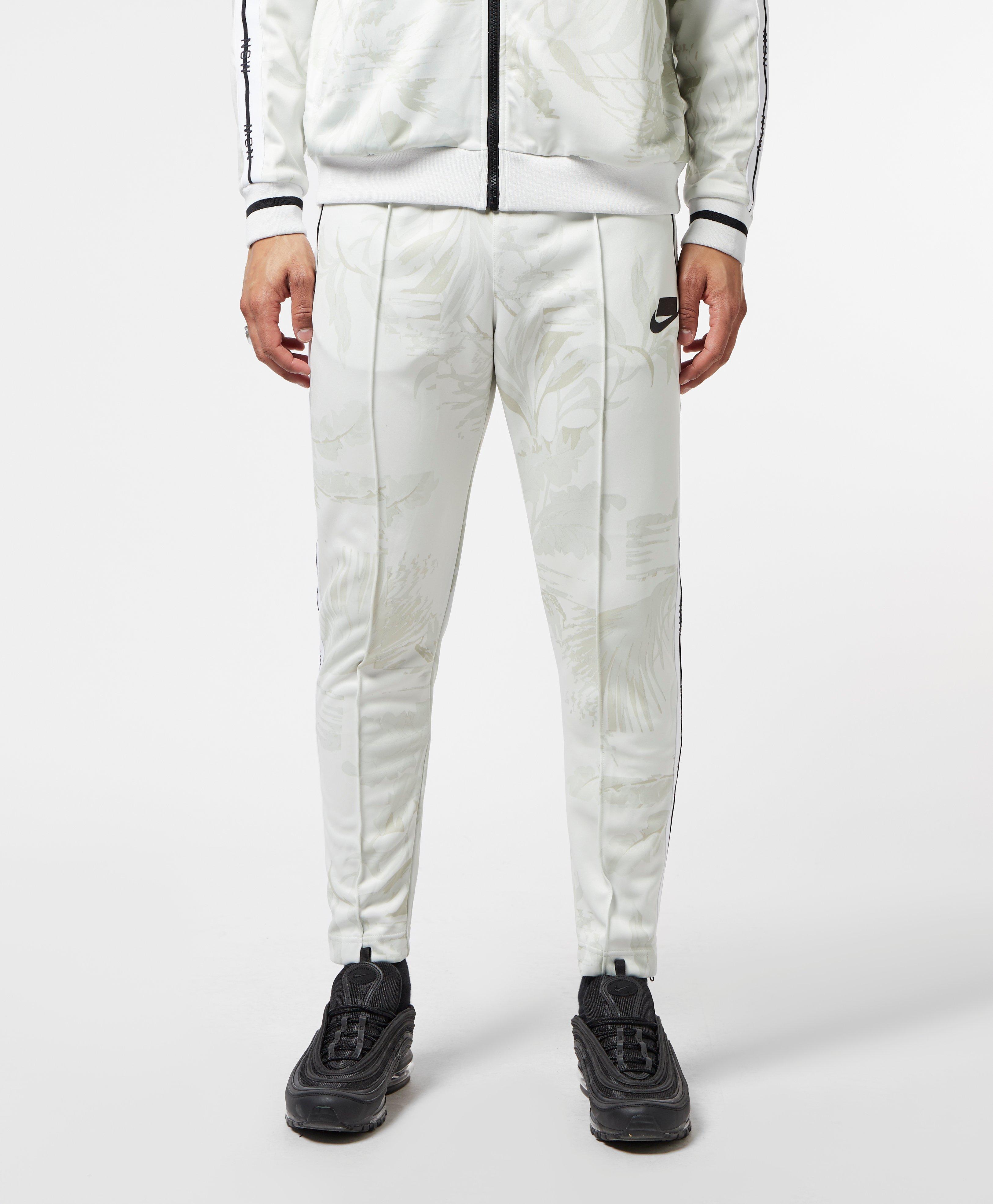 nike sportswear all over print track pants