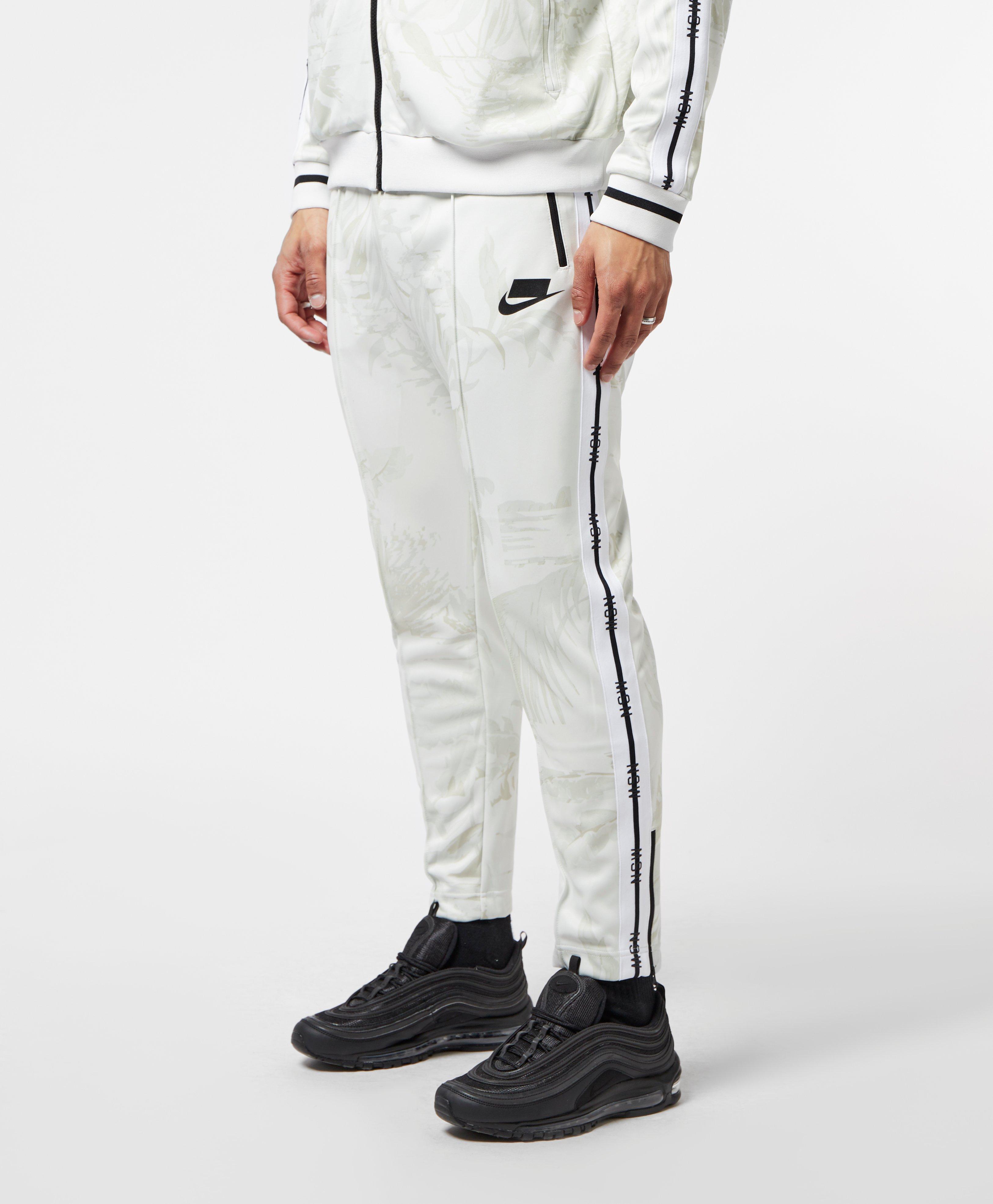nike sportswear all over print track pants