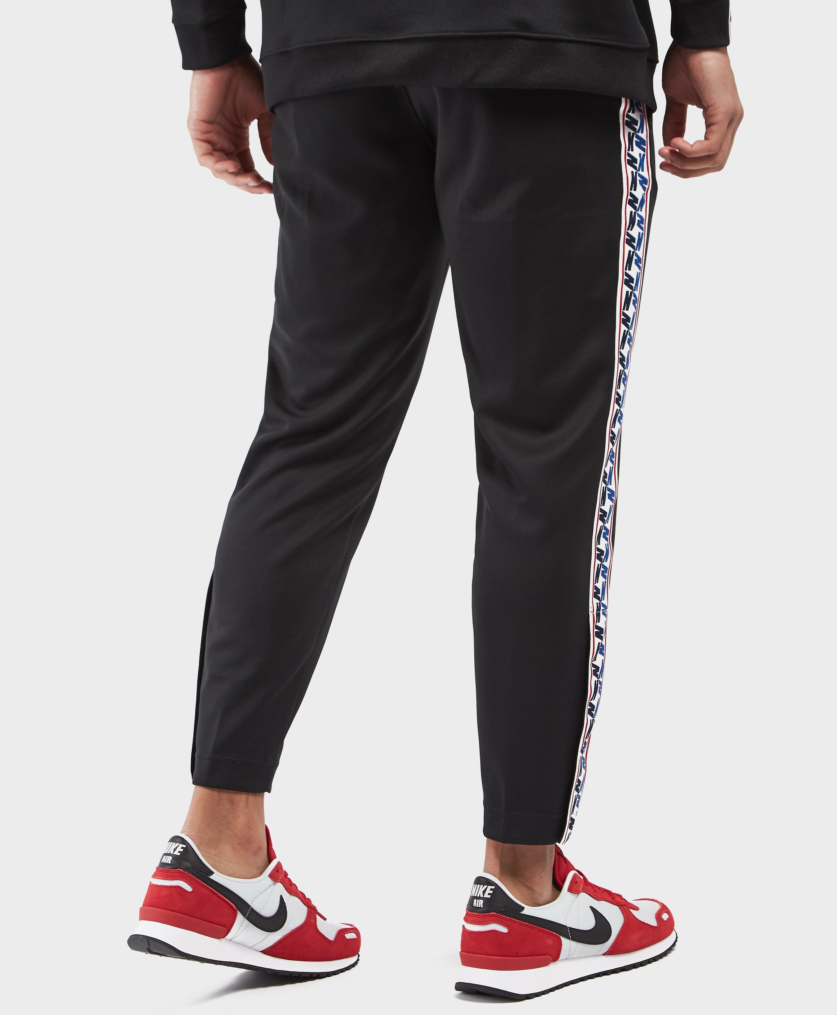 Nike Synthetic Taped Poly Track Pants in Black for Men | Lyst