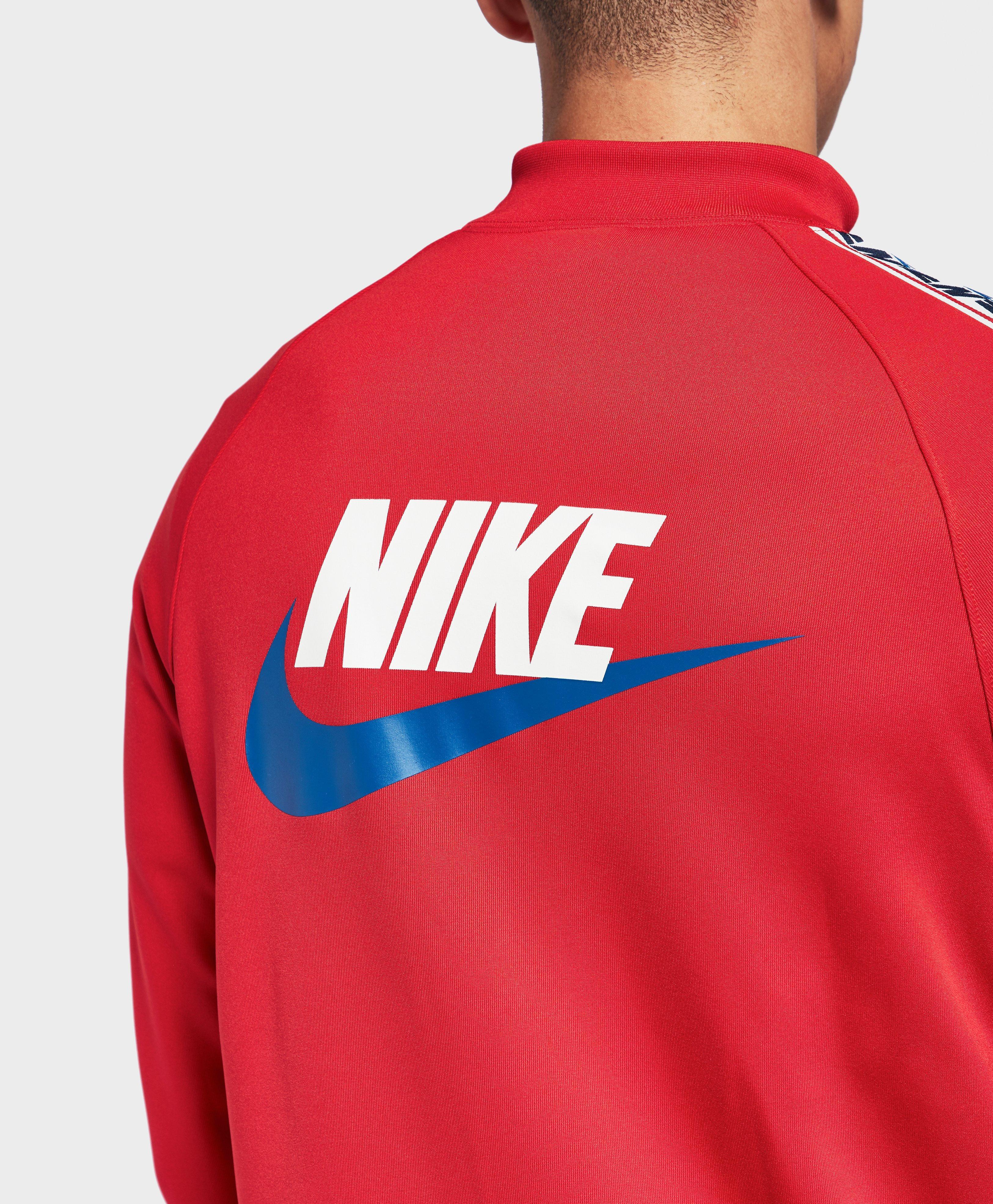 nike arch taped track top