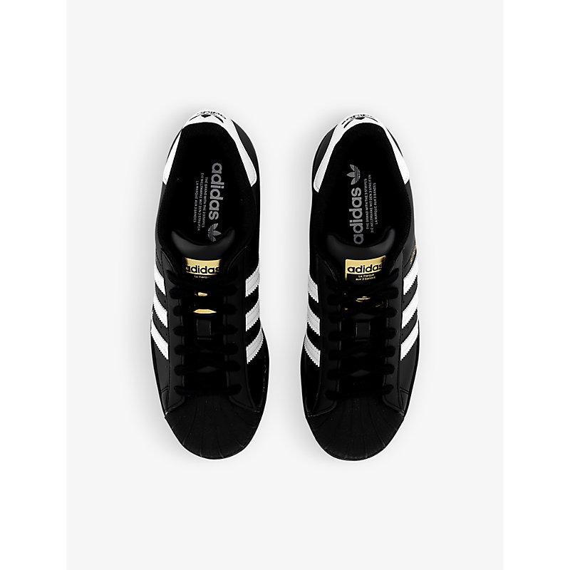 adidas Superstar Logo embossed Low top Leather Trainers in Black