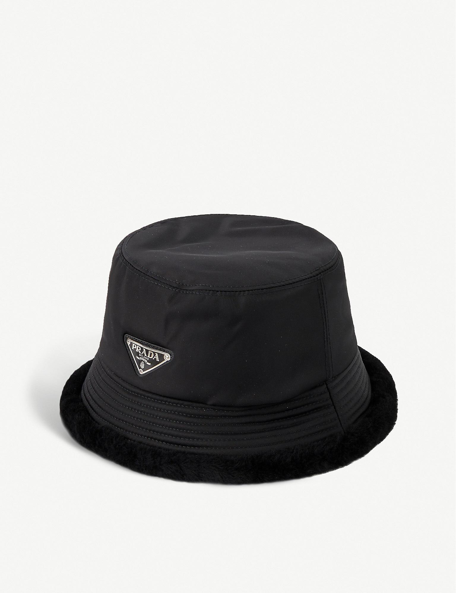 Prada Faux Fur-trimmed Logo-plaque Nylon Bucket Hat in Black for