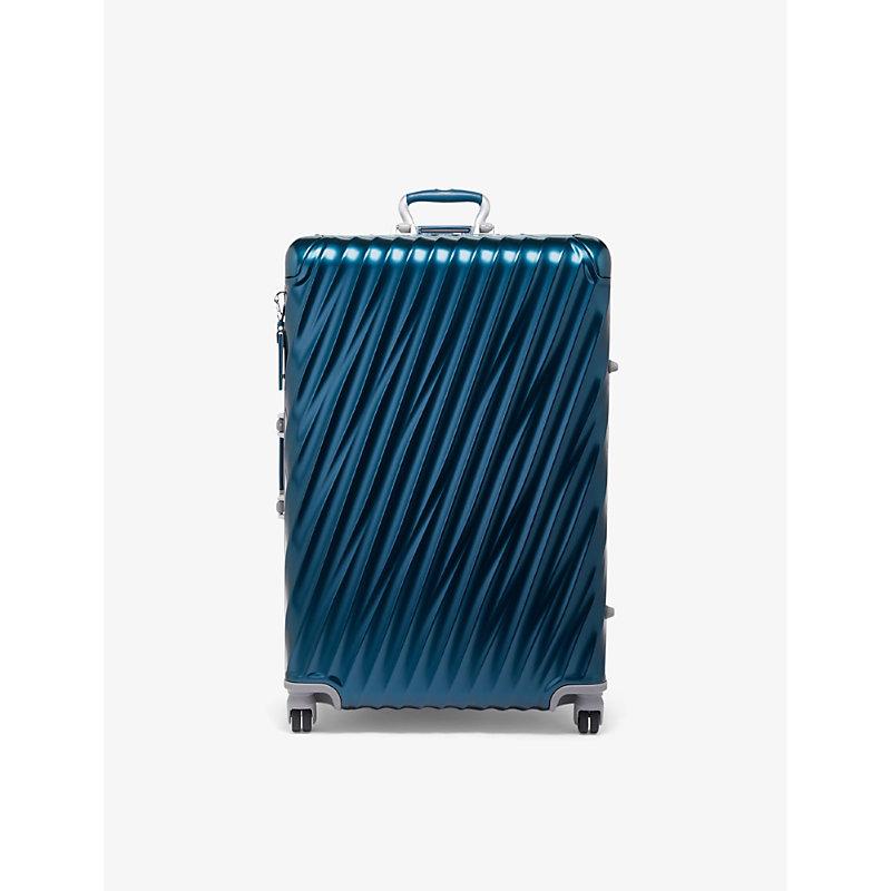 Tumi Extended Trip Expandable Fourwheeled Aluminium Suitcase in Blue