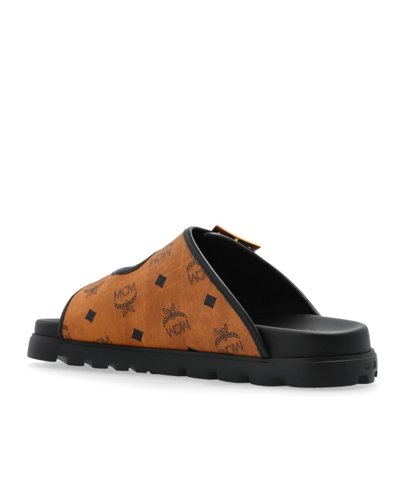 MCM Alphabet Slippers in Brown | Lyst