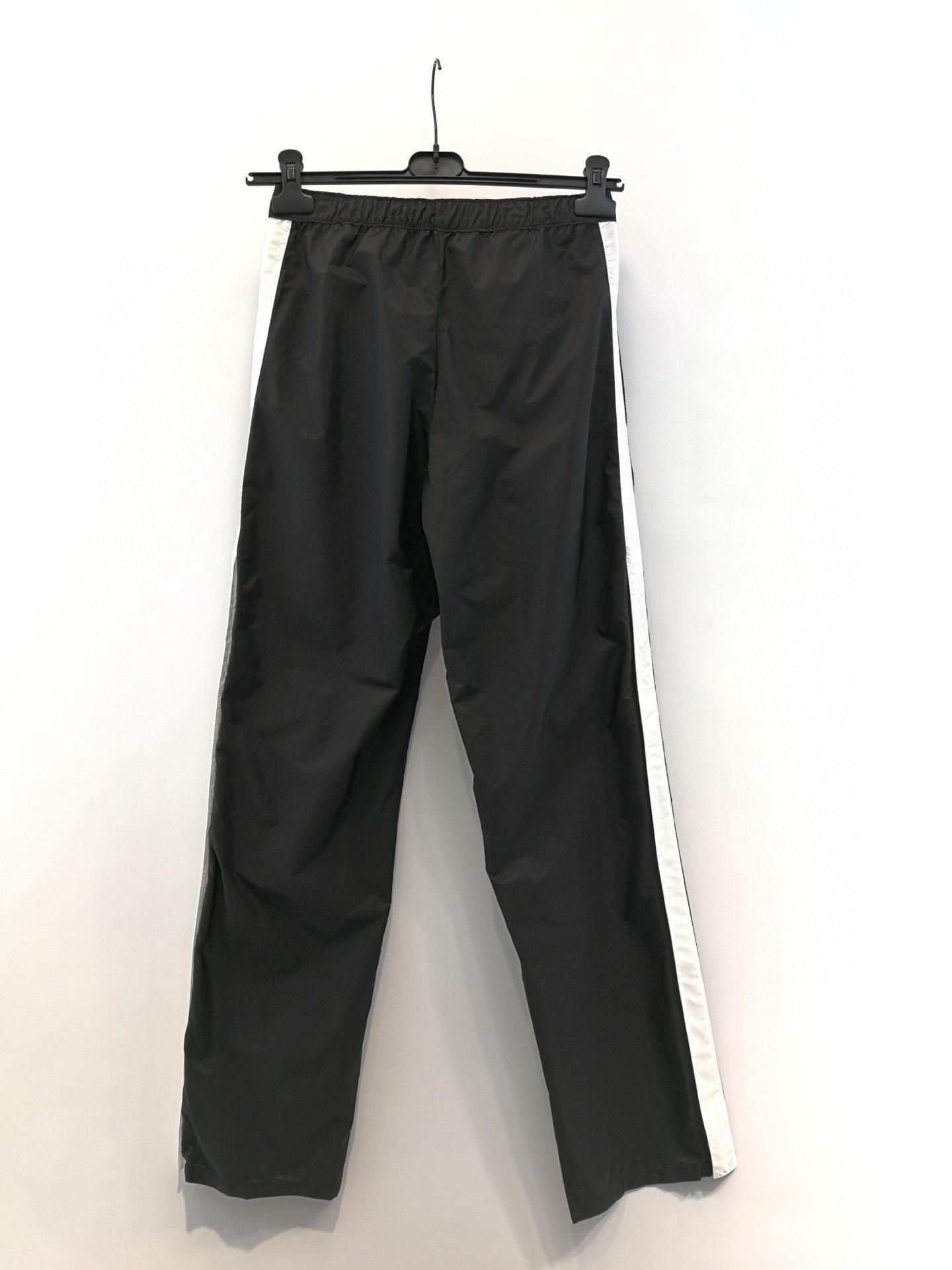 Prada Logo Printed Re-Nylon Pants in Black | Lyst