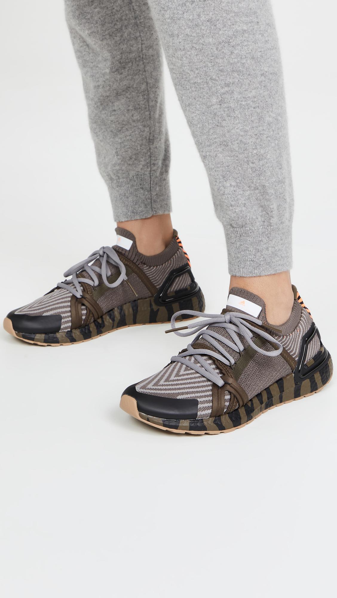 https://cdna.lystit.com/photos/shopbop/018b4e7f/adidas-by-stella-mccartney-DarkhaDovgryCblack-Asmc-Ultraboost-20-Graphic-Sneakers.jpeg