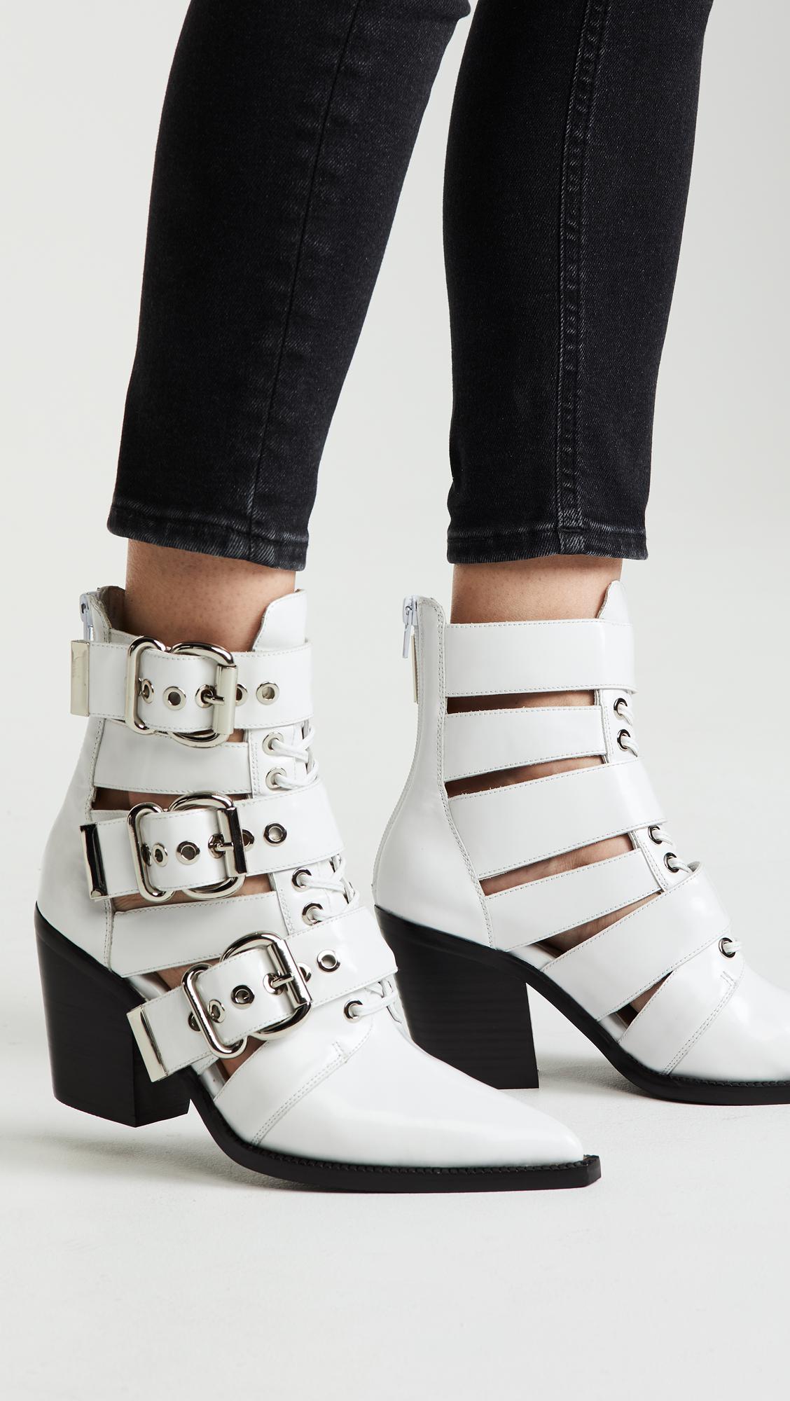 white booties with buckles