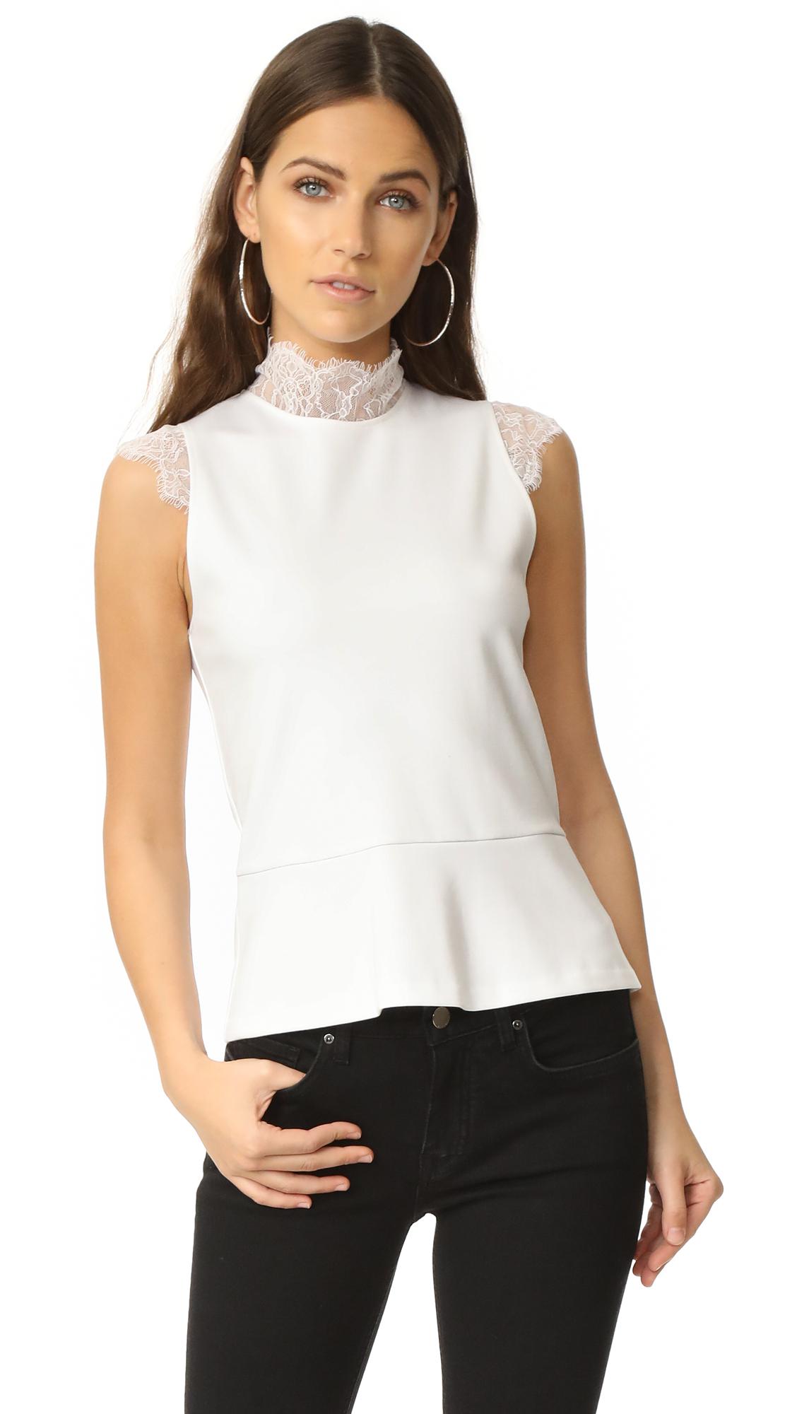 white sleeveless mock neck top