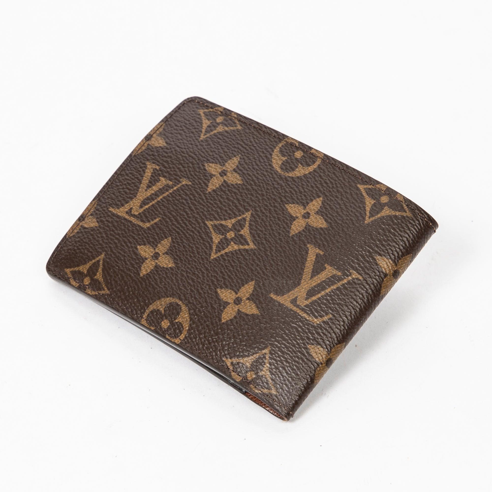 Louis Vuitton Portefeuille Multiple in Brown
