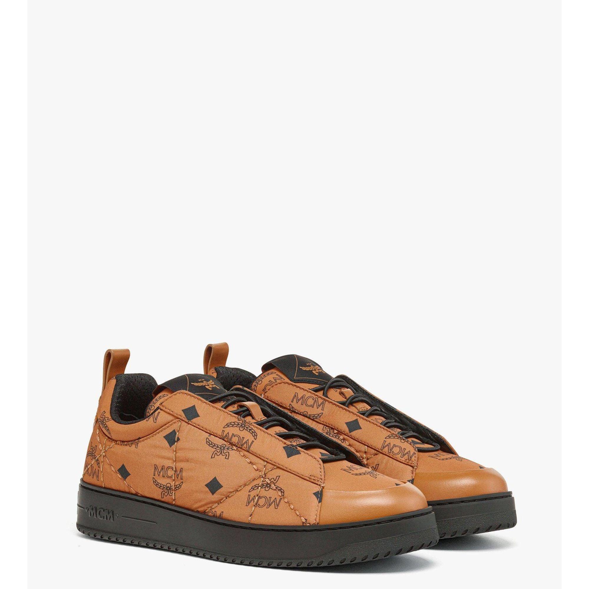 MCM Neo Terrain Lo sneakers in green showcasing modern streetwear design and luxury materials