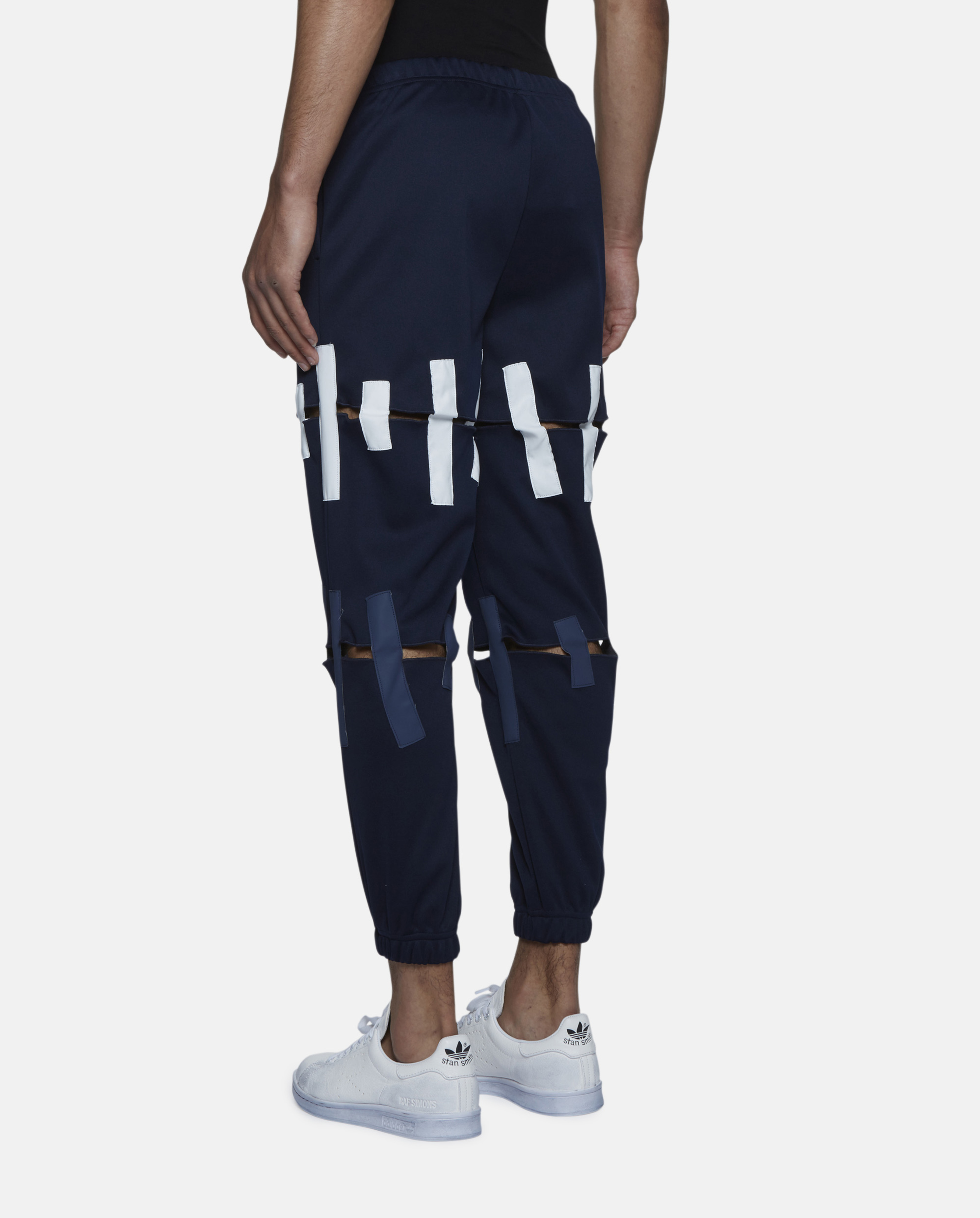 torn track pants