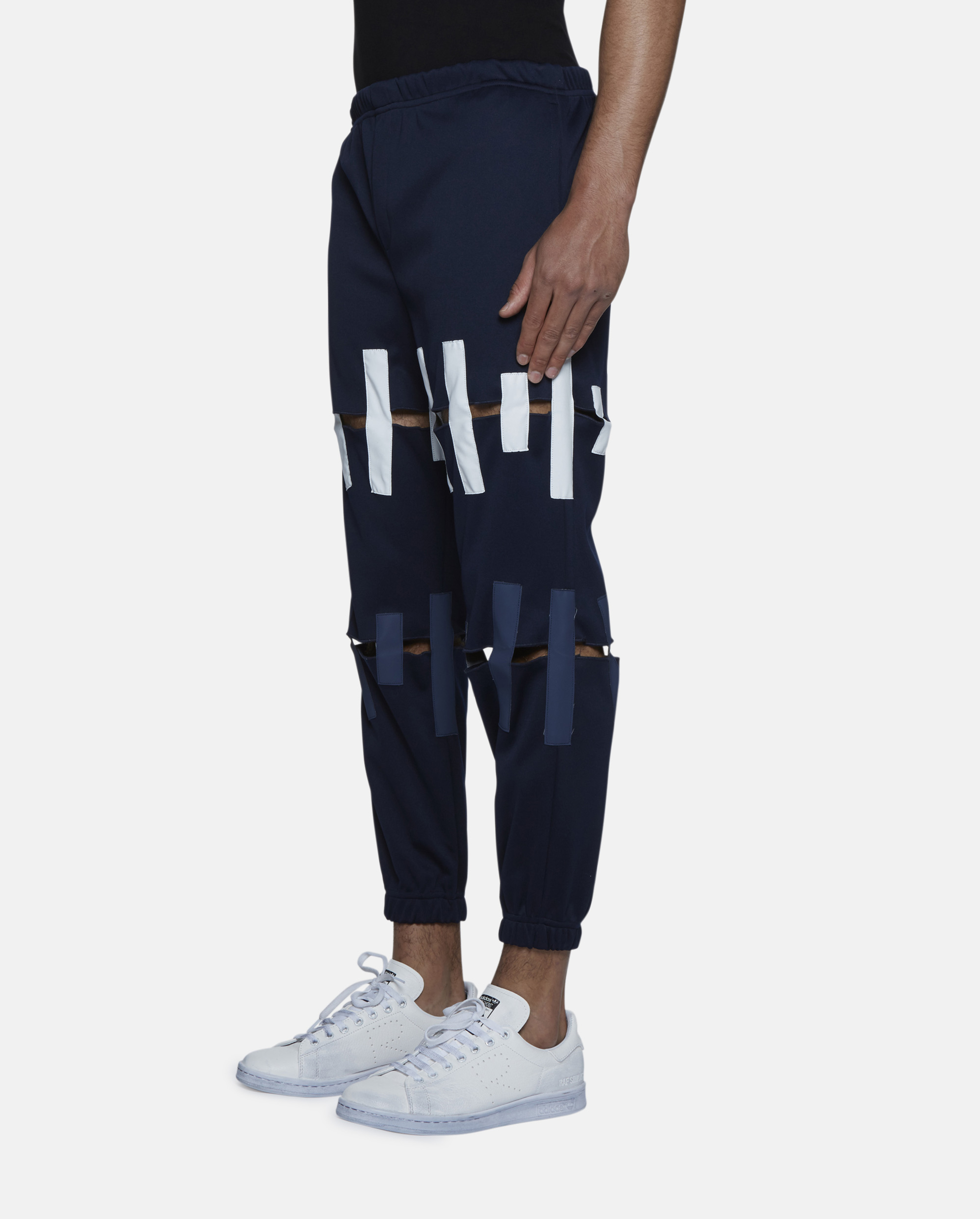 torn track pants