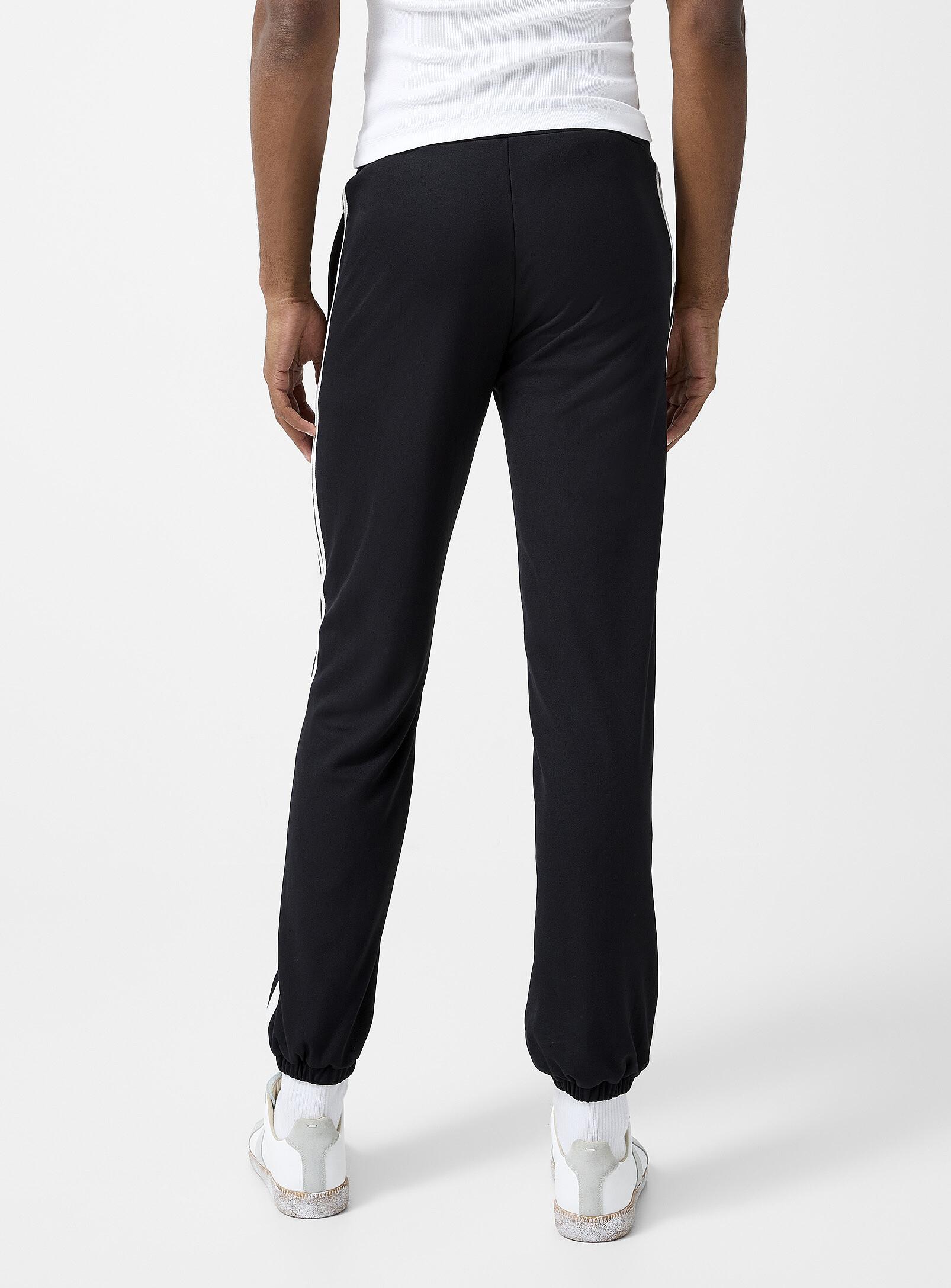 Sporty & Rich Sr Runner 90s Elio Track Pant in Black for Men