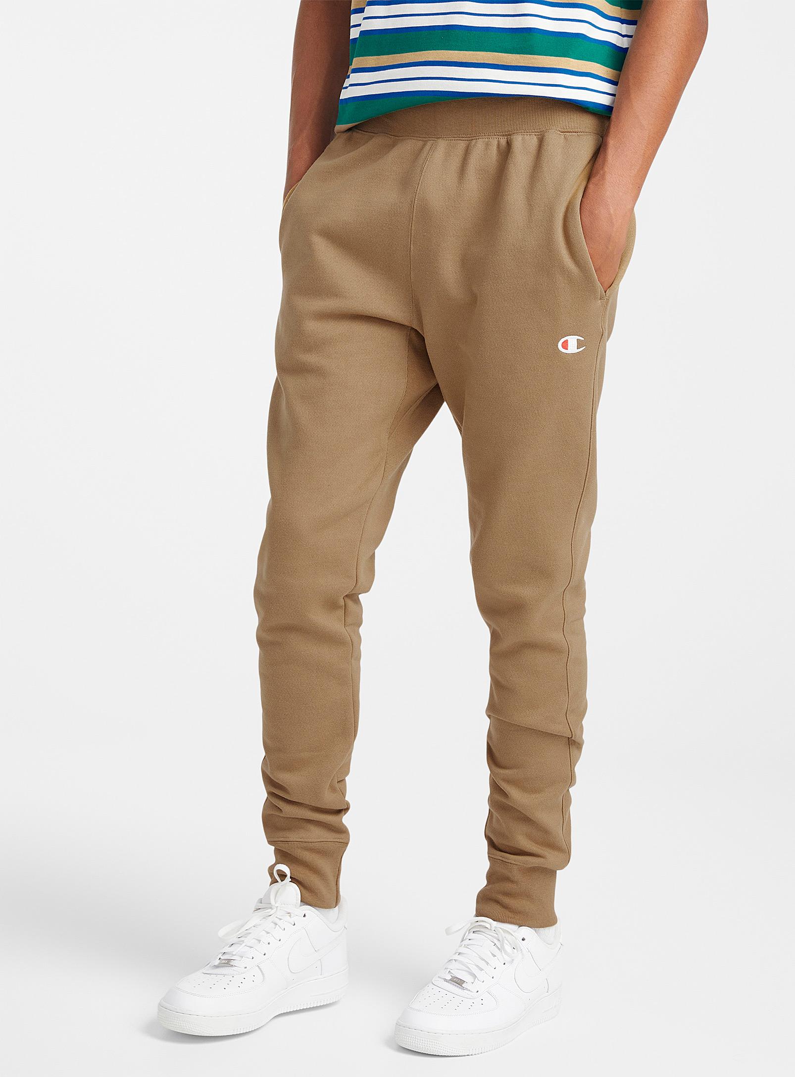 https://cdna.lystit.com/photos/simons/341a2e6b/champion-Brown-Reverse-Weave-Fleece-joggers.jpeg