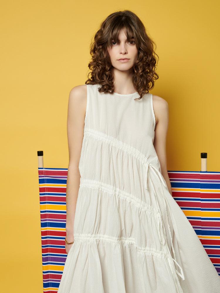 ghospell eleanor ruched midi dress If flowy styles with an edge are your thing, the Eleanor Ruched Midi Dress is a must-have. With intricate drawstring details and a light, breezy fabric, this dress ensures you look