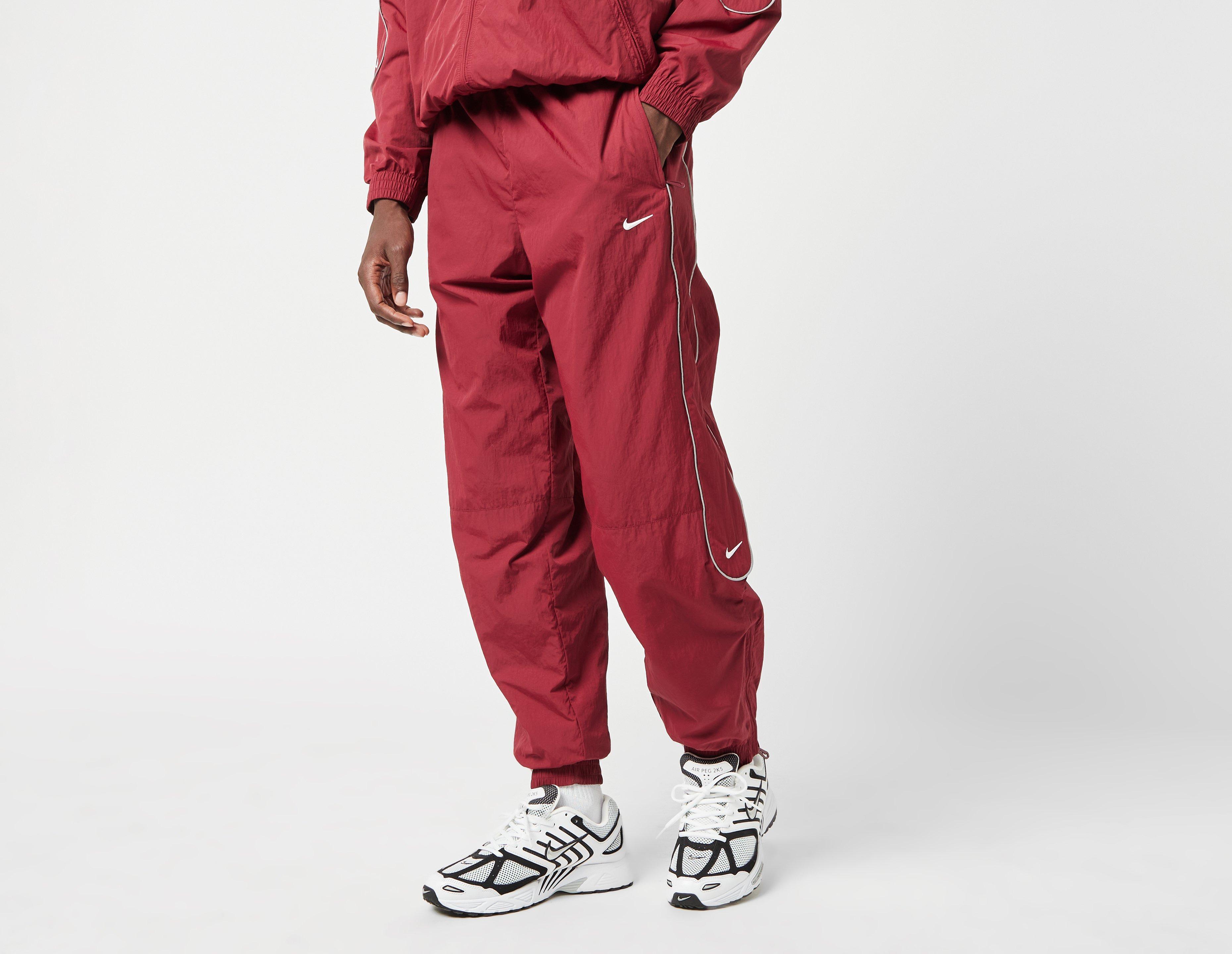 Nike track pants red online