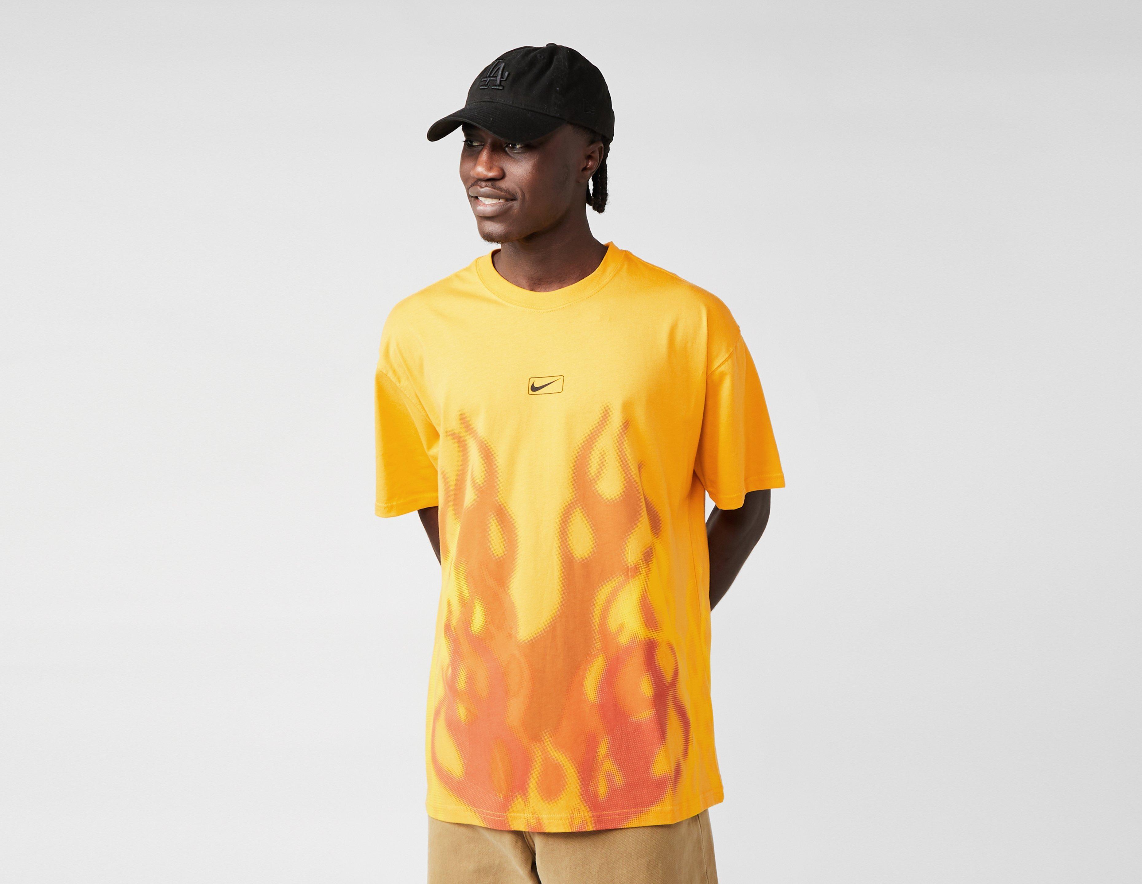 black nike shirt with yellow swoosh