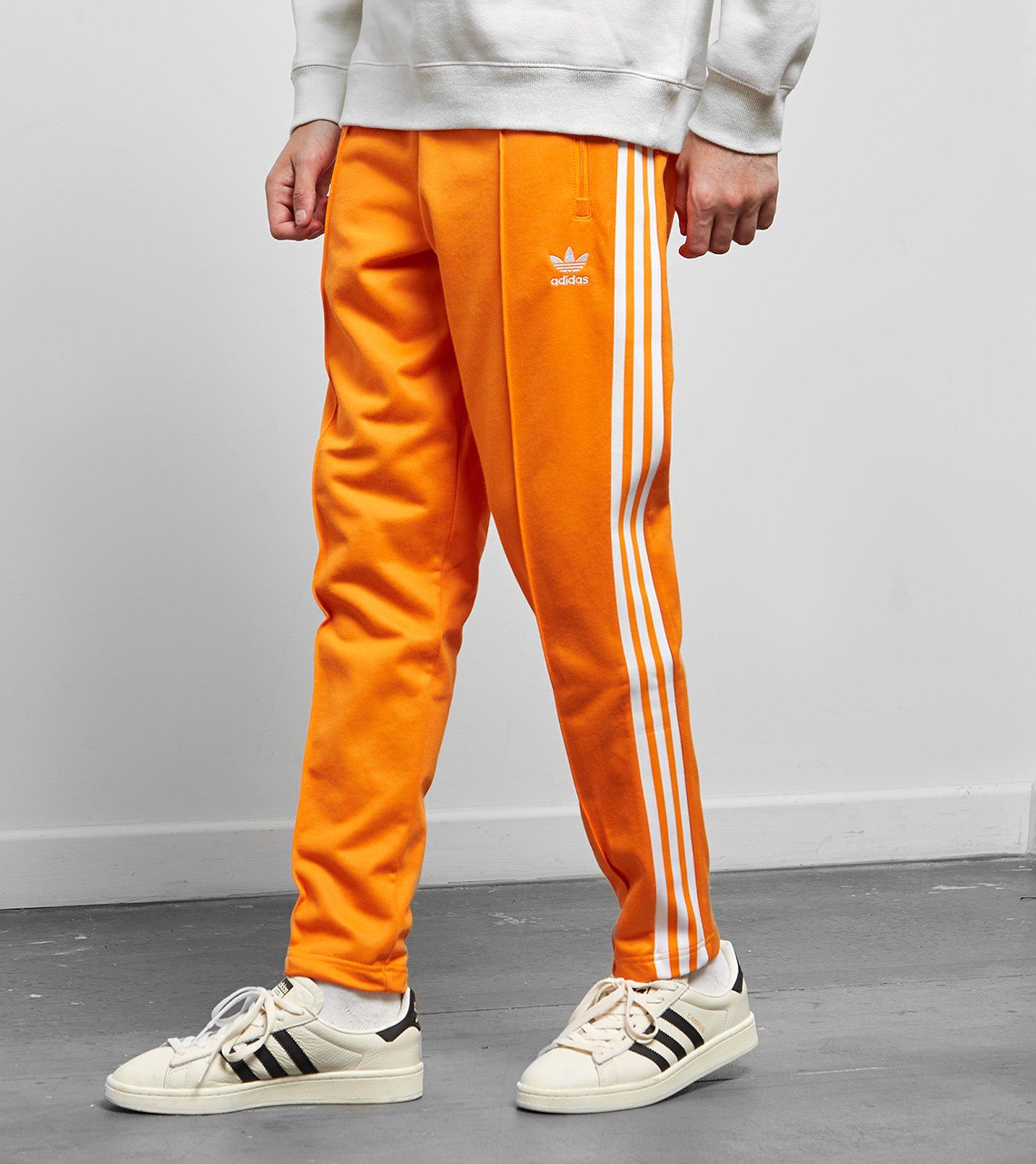 adidas beckenbauer track pants orange