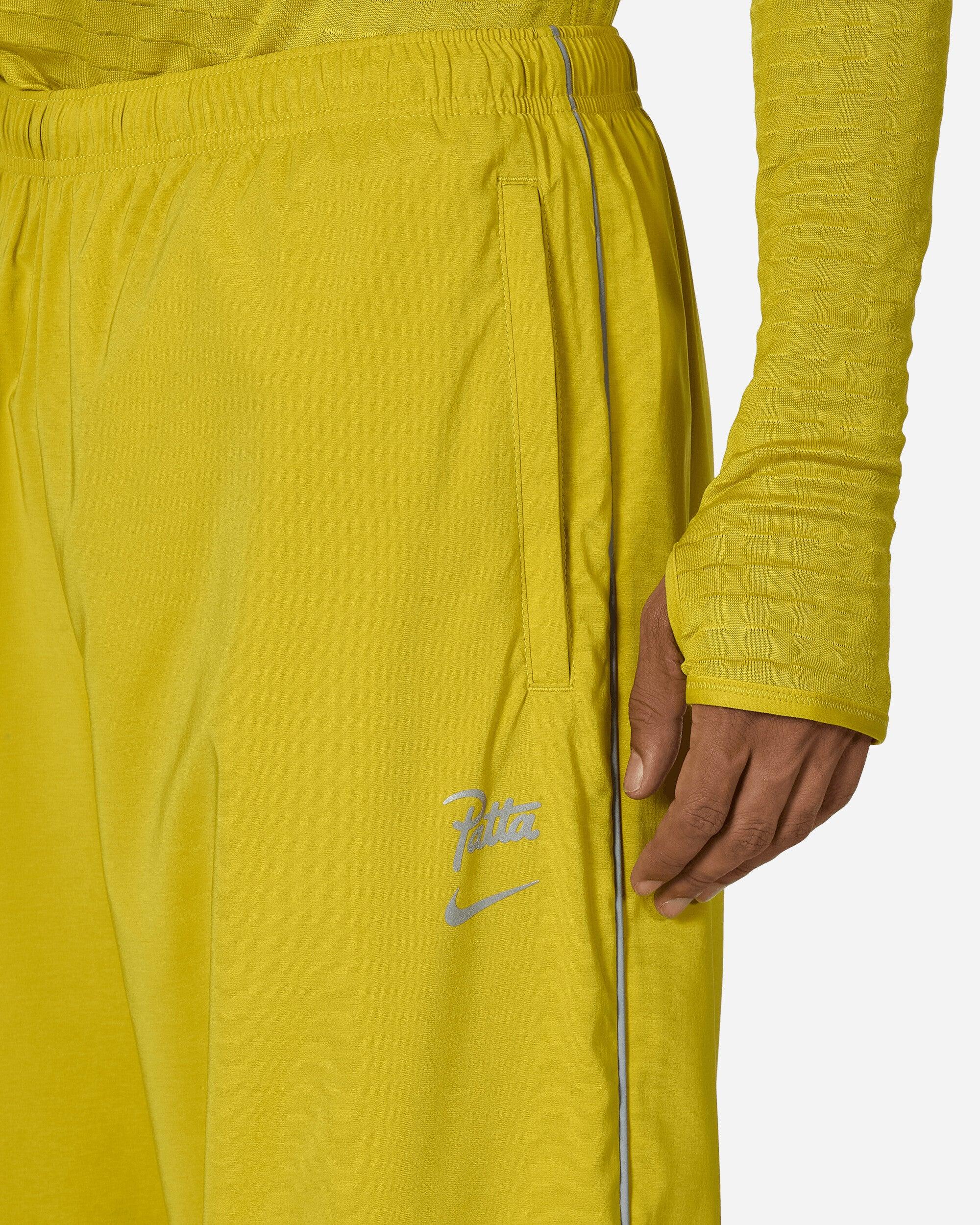nike track pants yellow