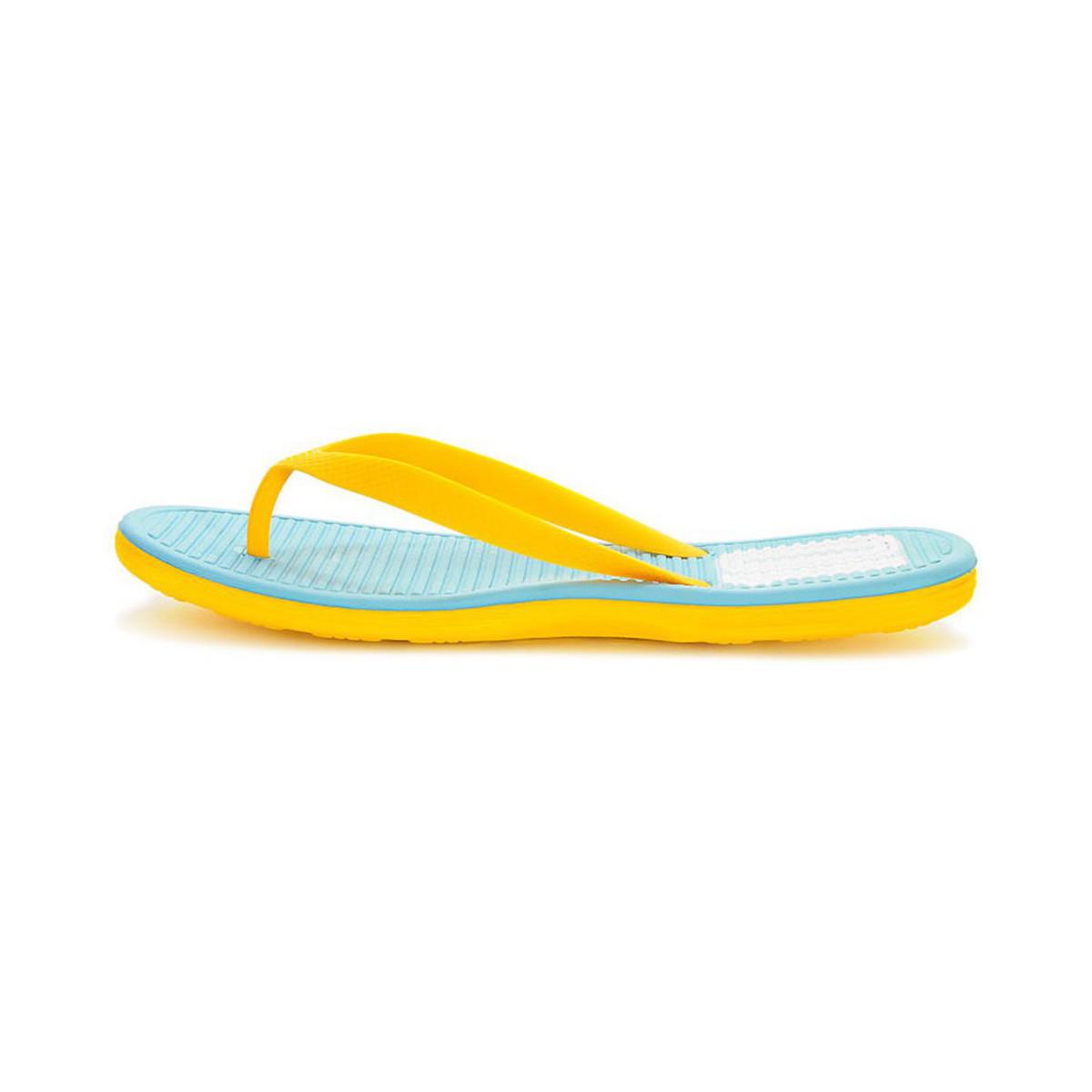 yellow nike flip flops
