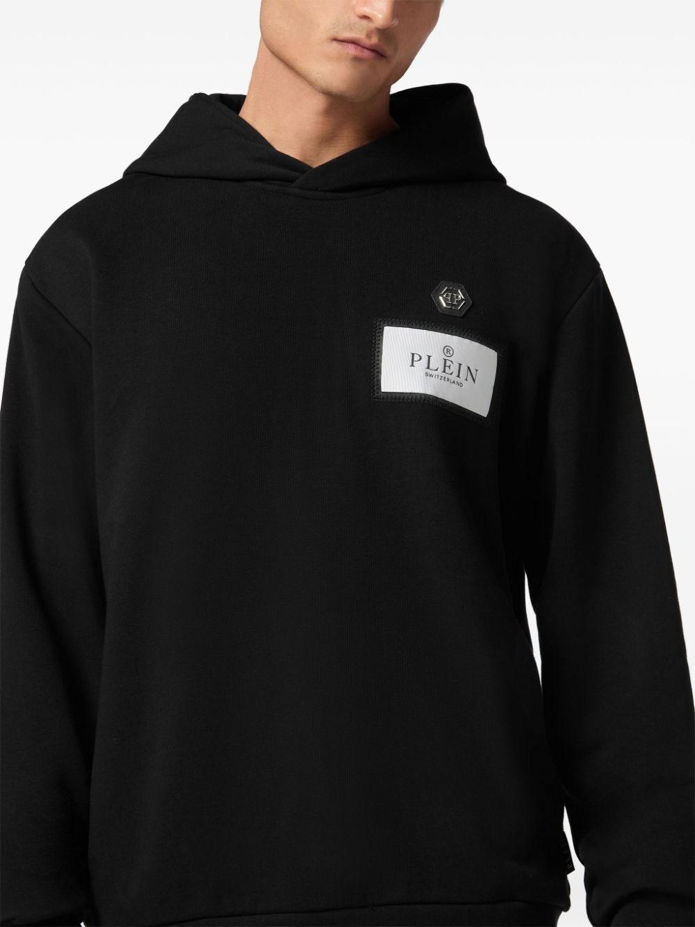 パーカー・フーディ PHILIPP PLEIN Men Hoodies MJB3616 PTE003N 0202 Black Philipp Plein Logo Patch Hoodie - Black | PAECMJB3611PTE003N0202