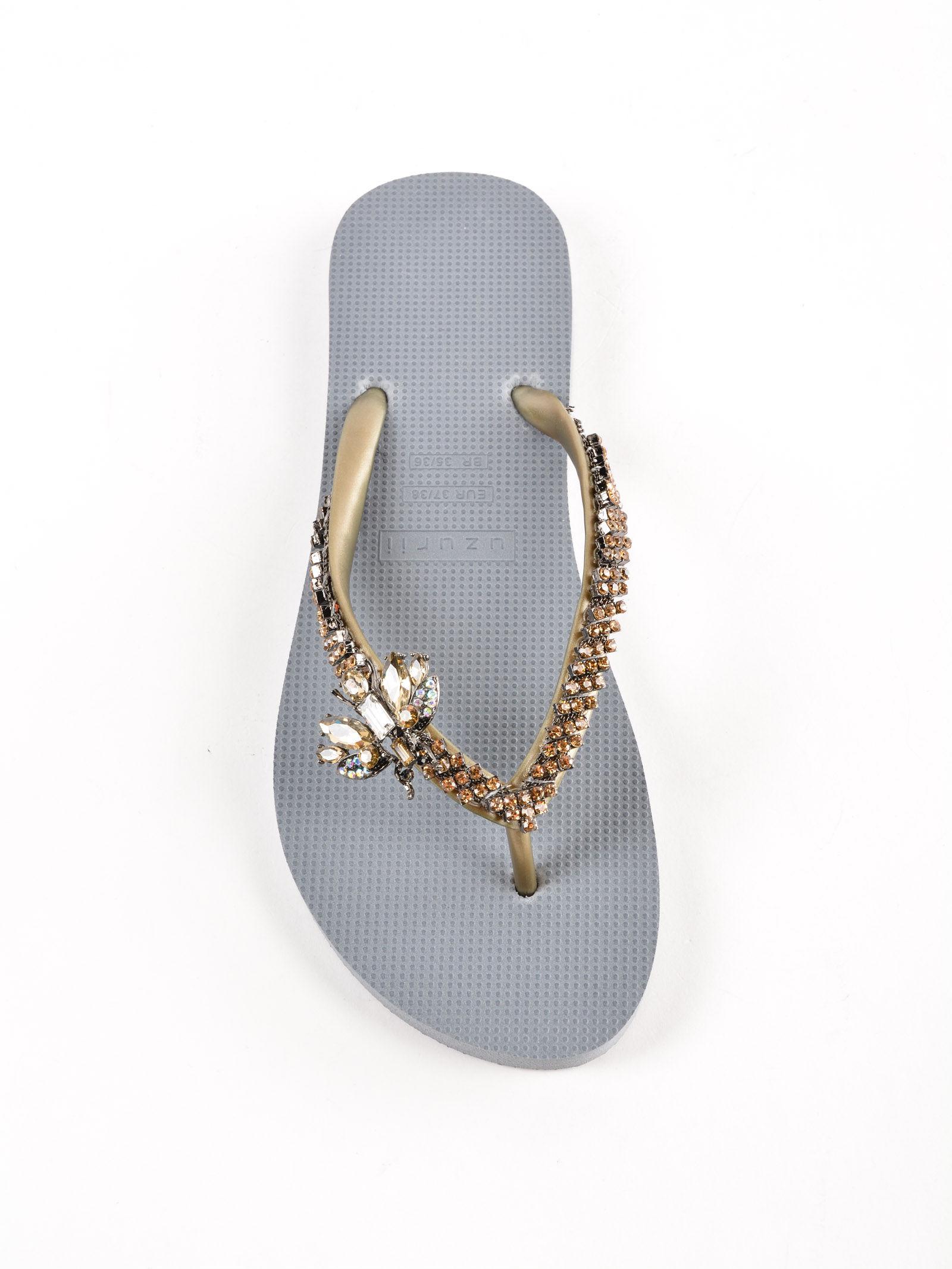 gold and silver flip flops