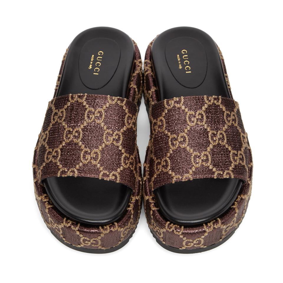 brown and gold gucci slides