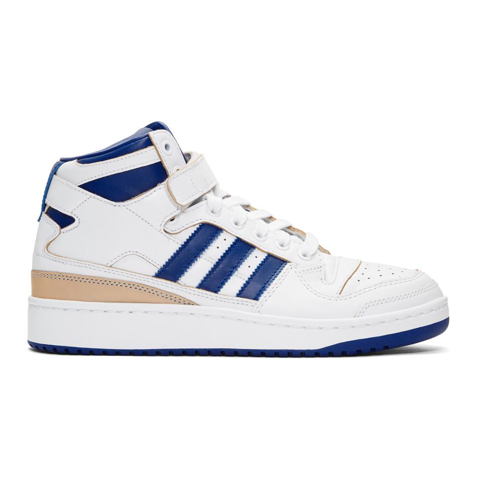 blue and white adidas forum