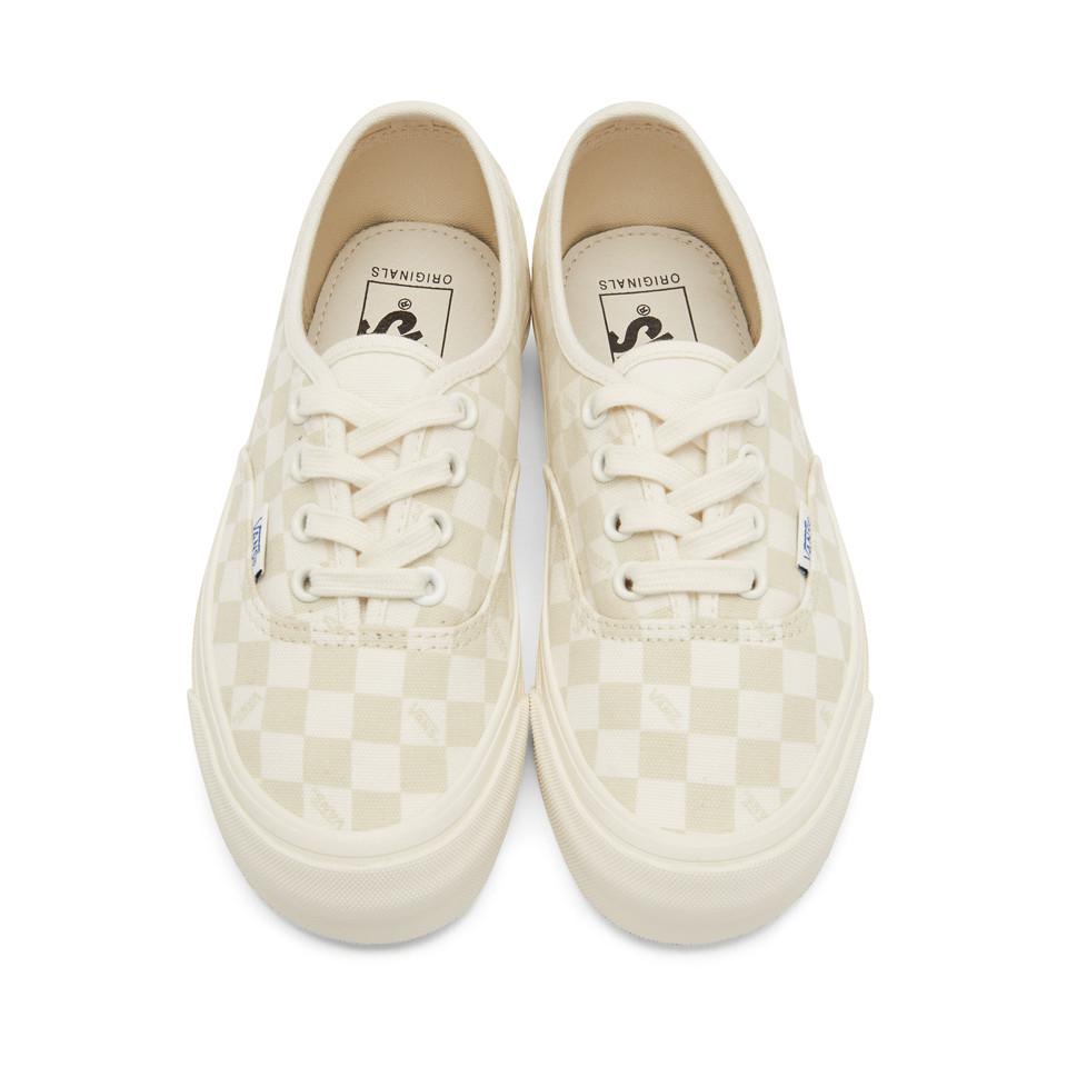beige and white checkered vans