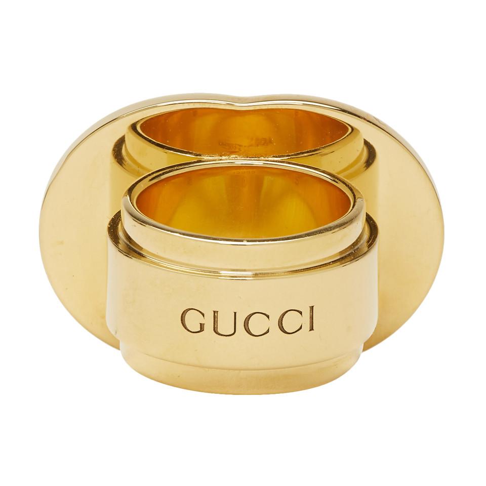 gold gucci ring with red and green