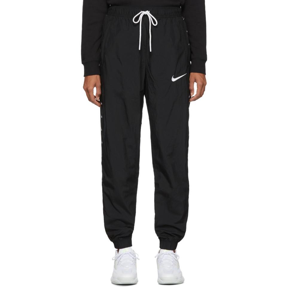 Nike Black Woven Swoosh Lounge Pants | Lyst