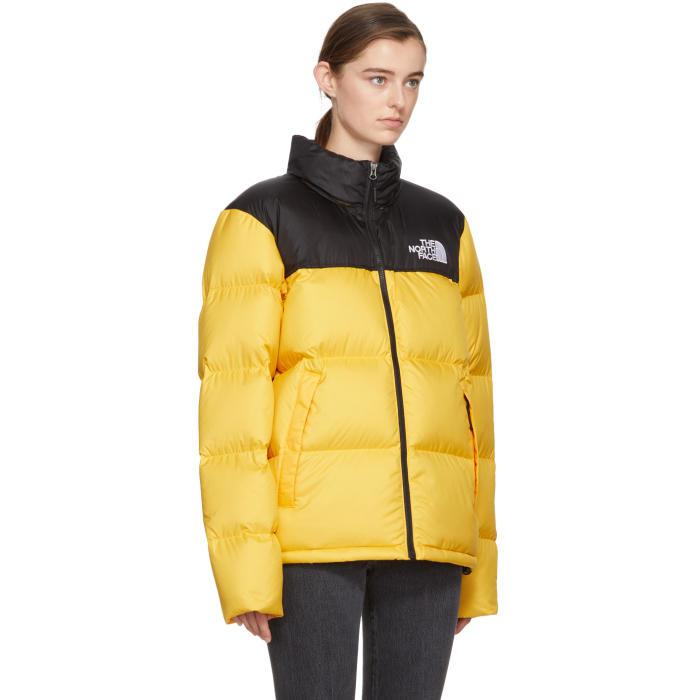 The North Face Satin Yellow & Black Down Novelty Nuptse Jacket - Lyst