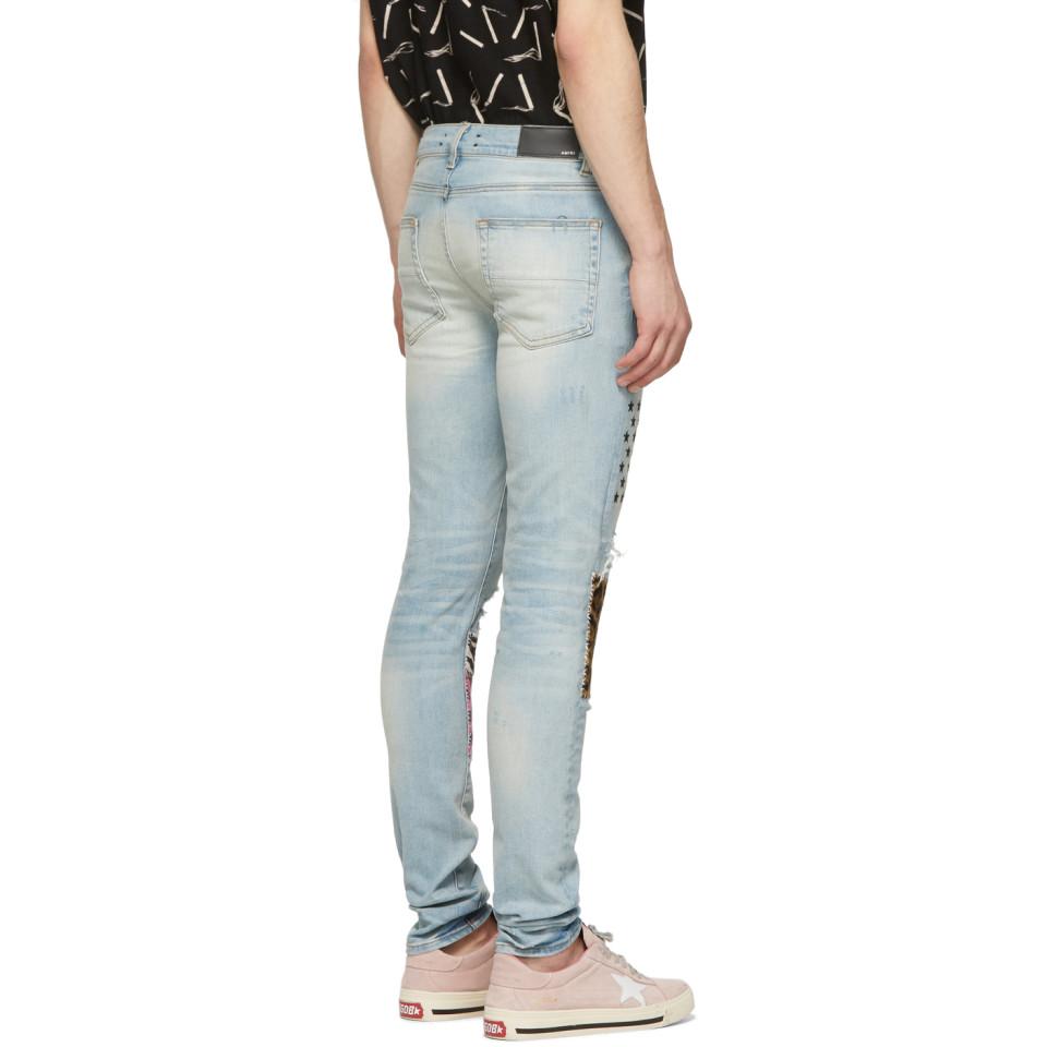 amiri blue art patch jeans