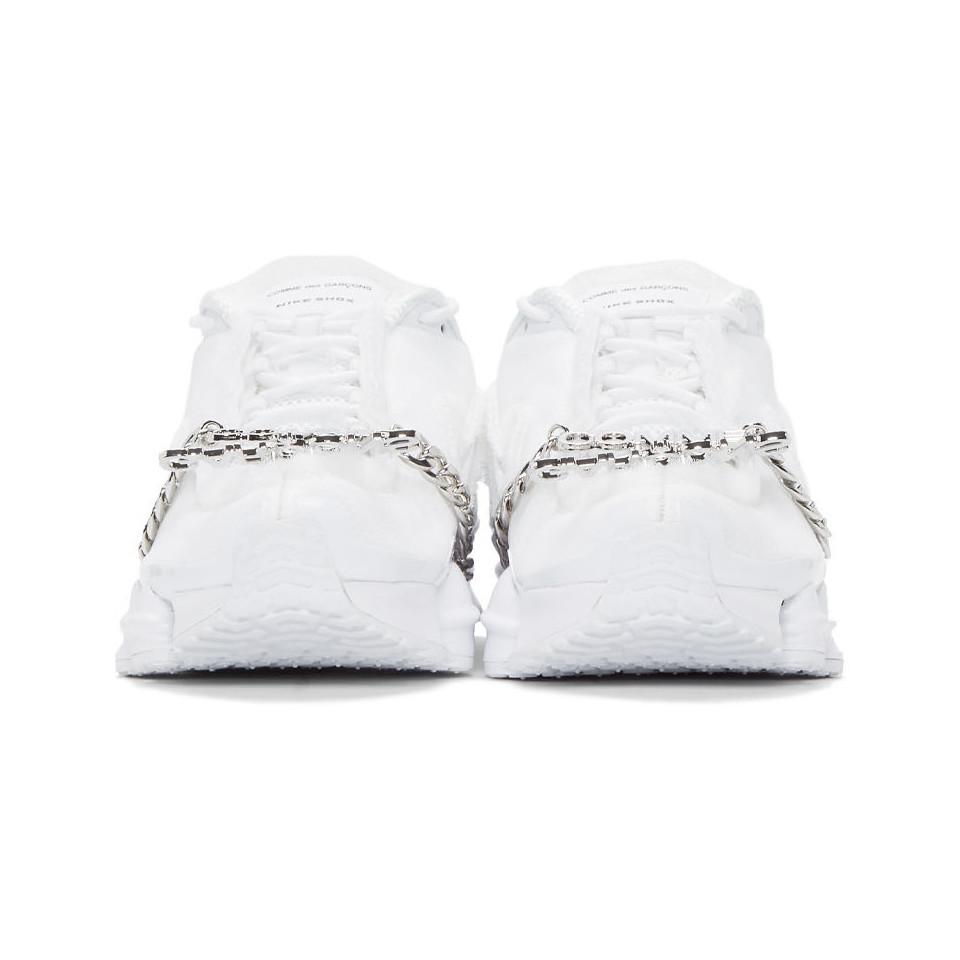white nike edition cdg shox tl sneakers