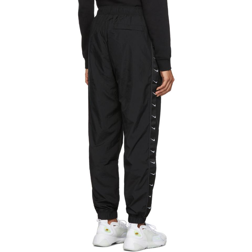 Nike Black Woven Swoosh Lounge Pants | Lyst