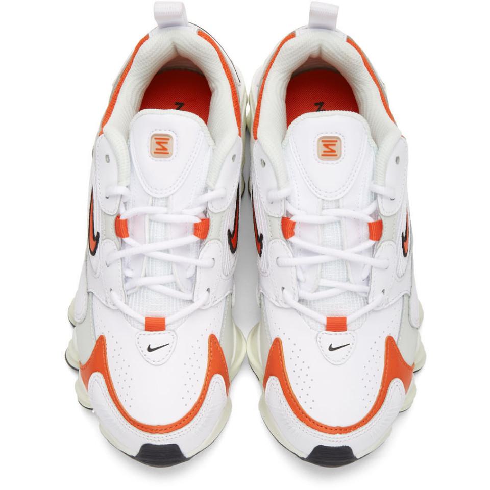 nike shox tl nova white and orange sneakers