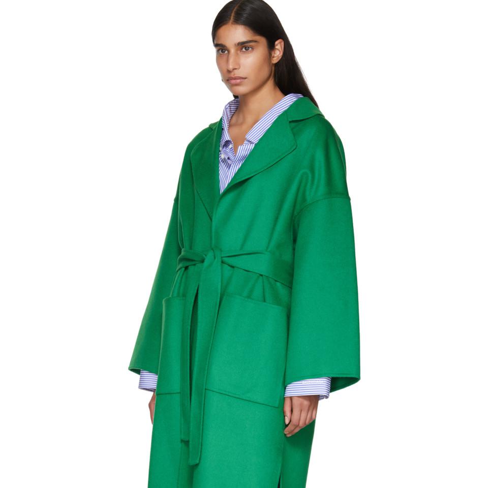 belted green coat