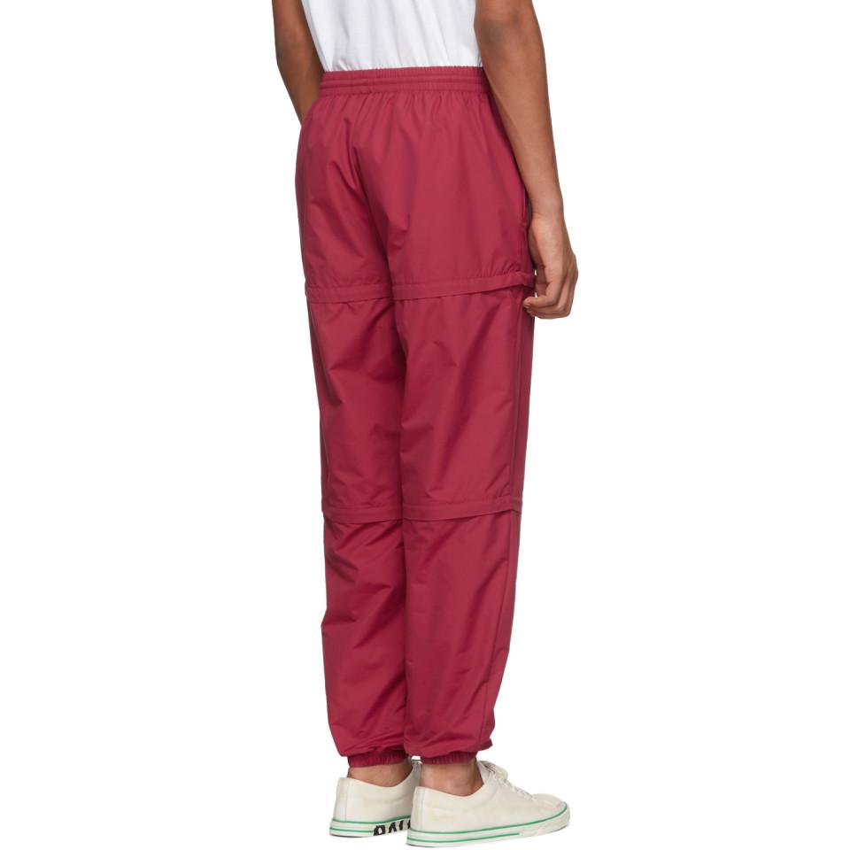 red nylon track pants