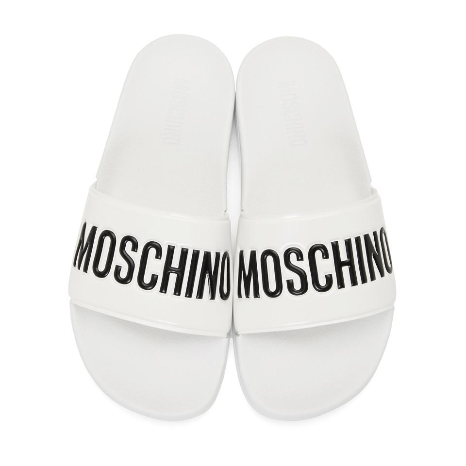 white moschino slides