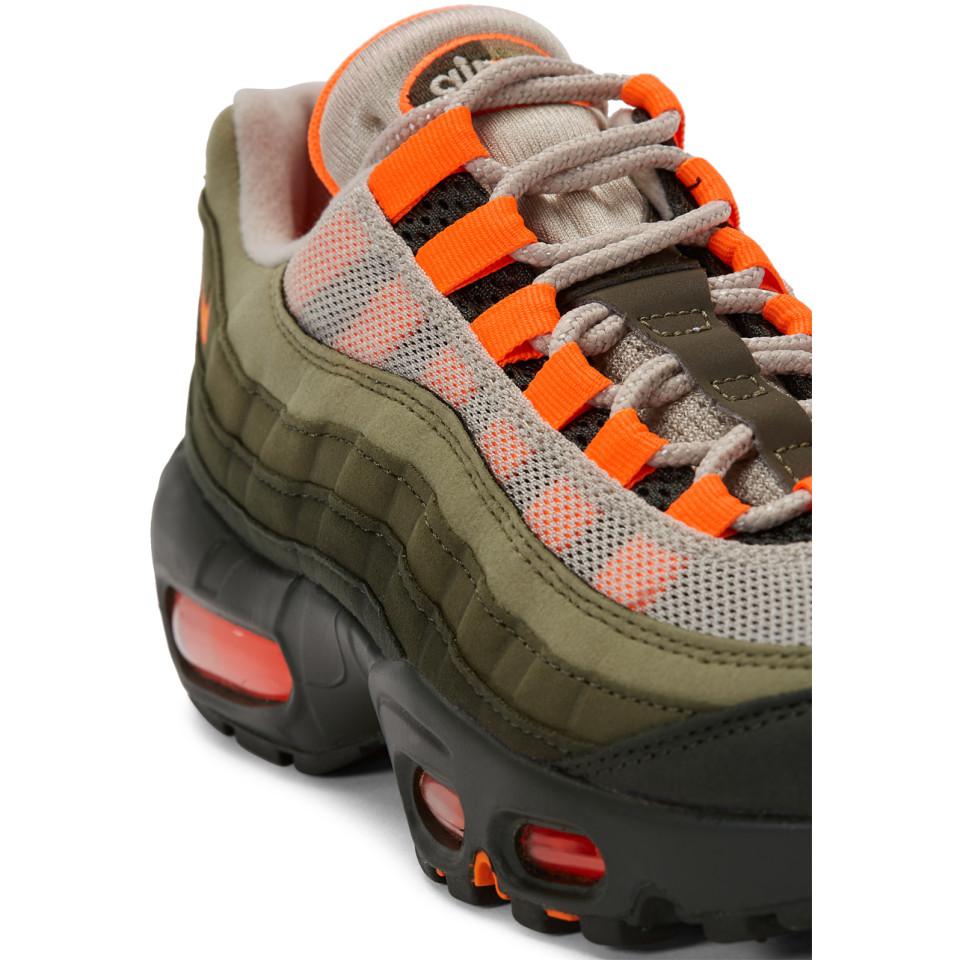 orange and green nike sneakers