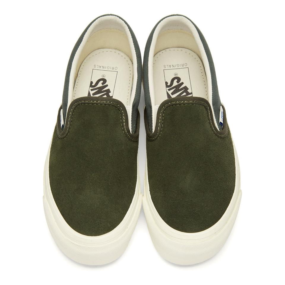 dark green vans slip on