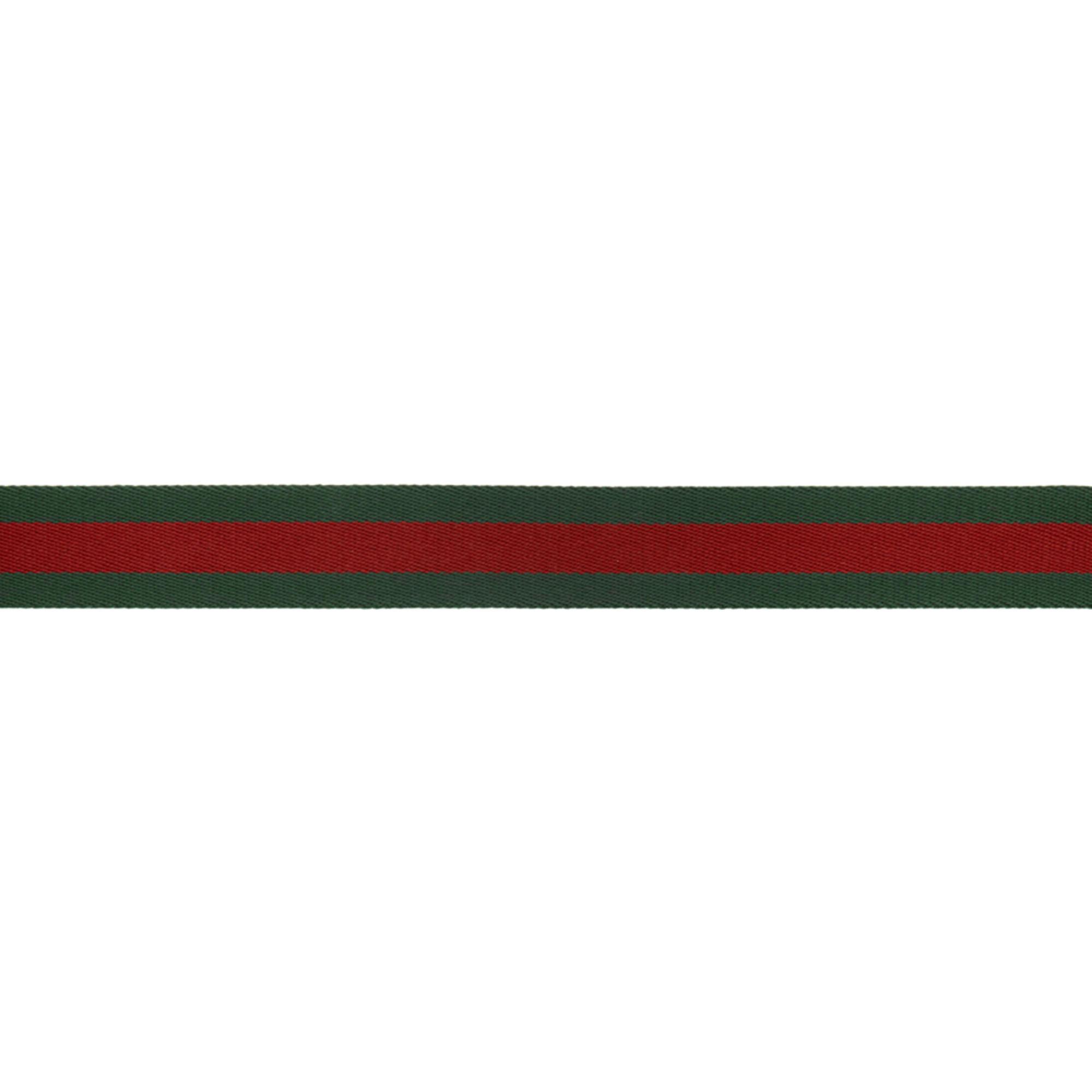 gold gucci ring with red and green