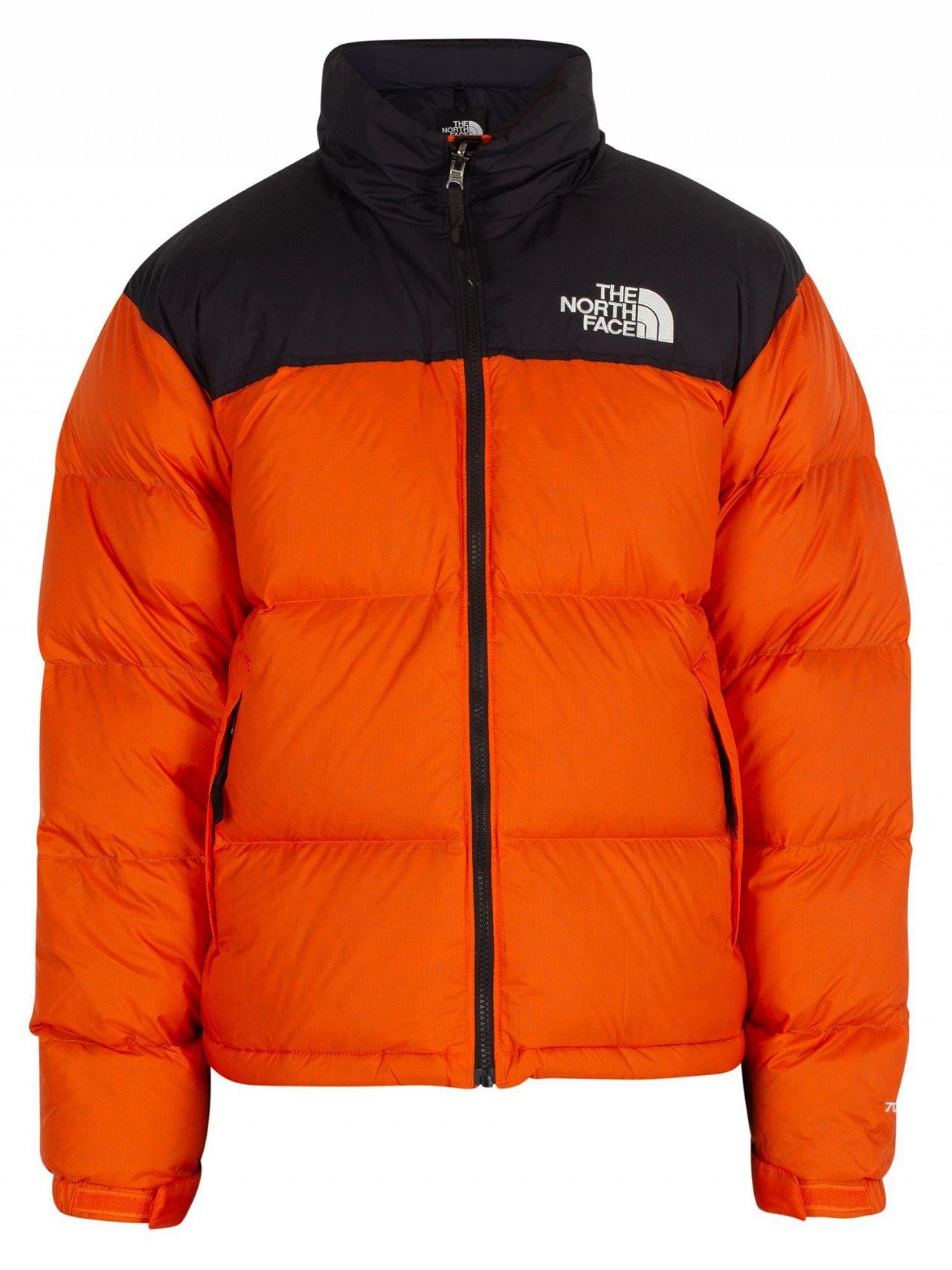 orange north face puffer coat 