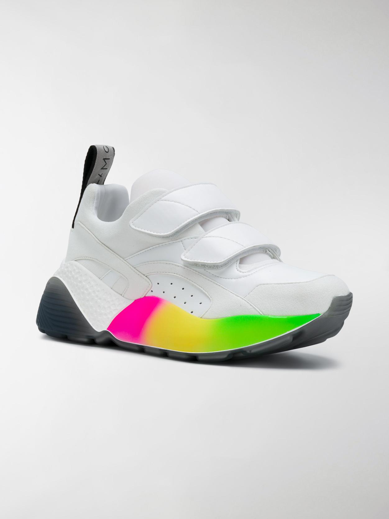 white and rainbow sneakers