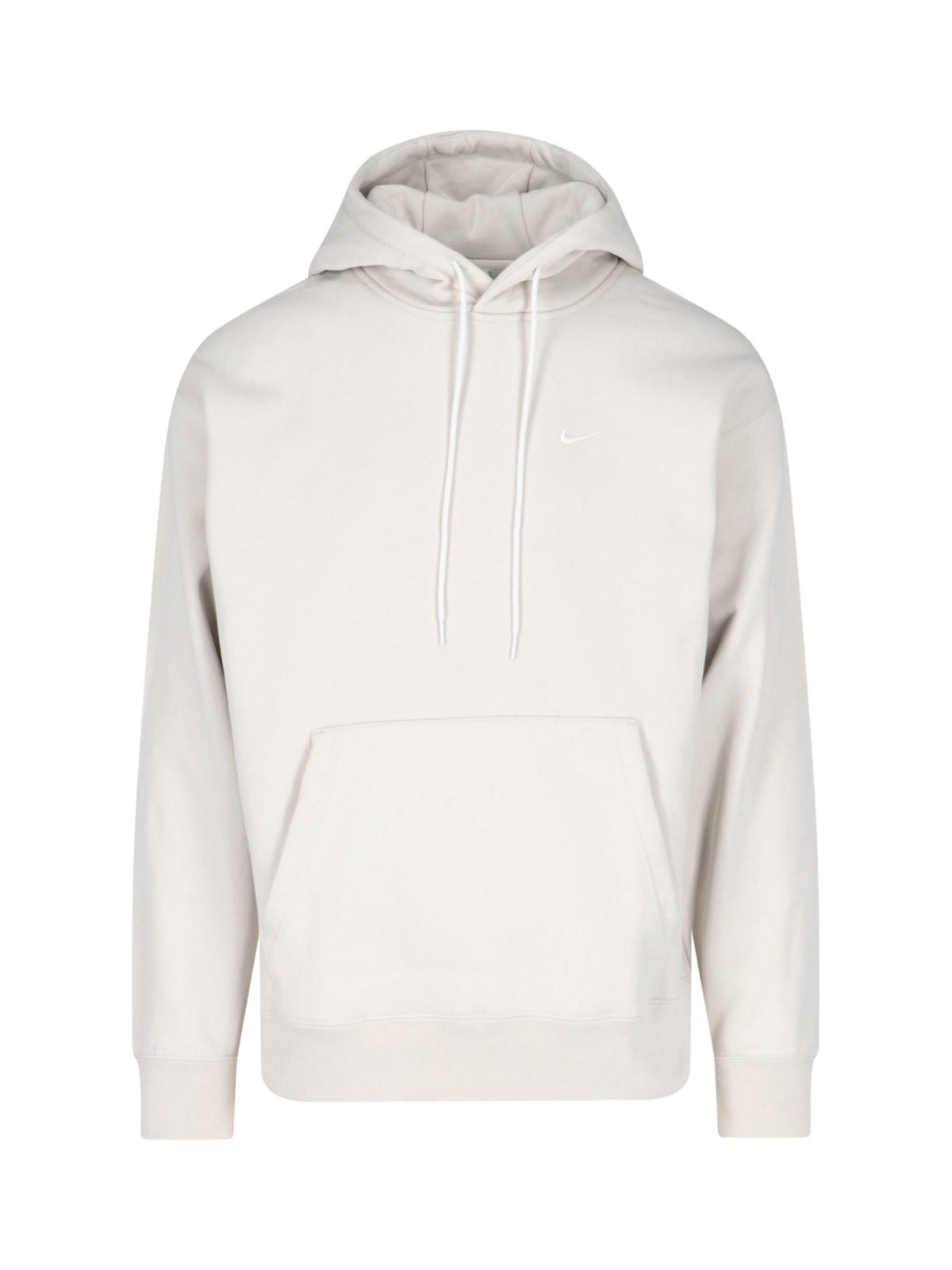 white nike hoodie with orange logo