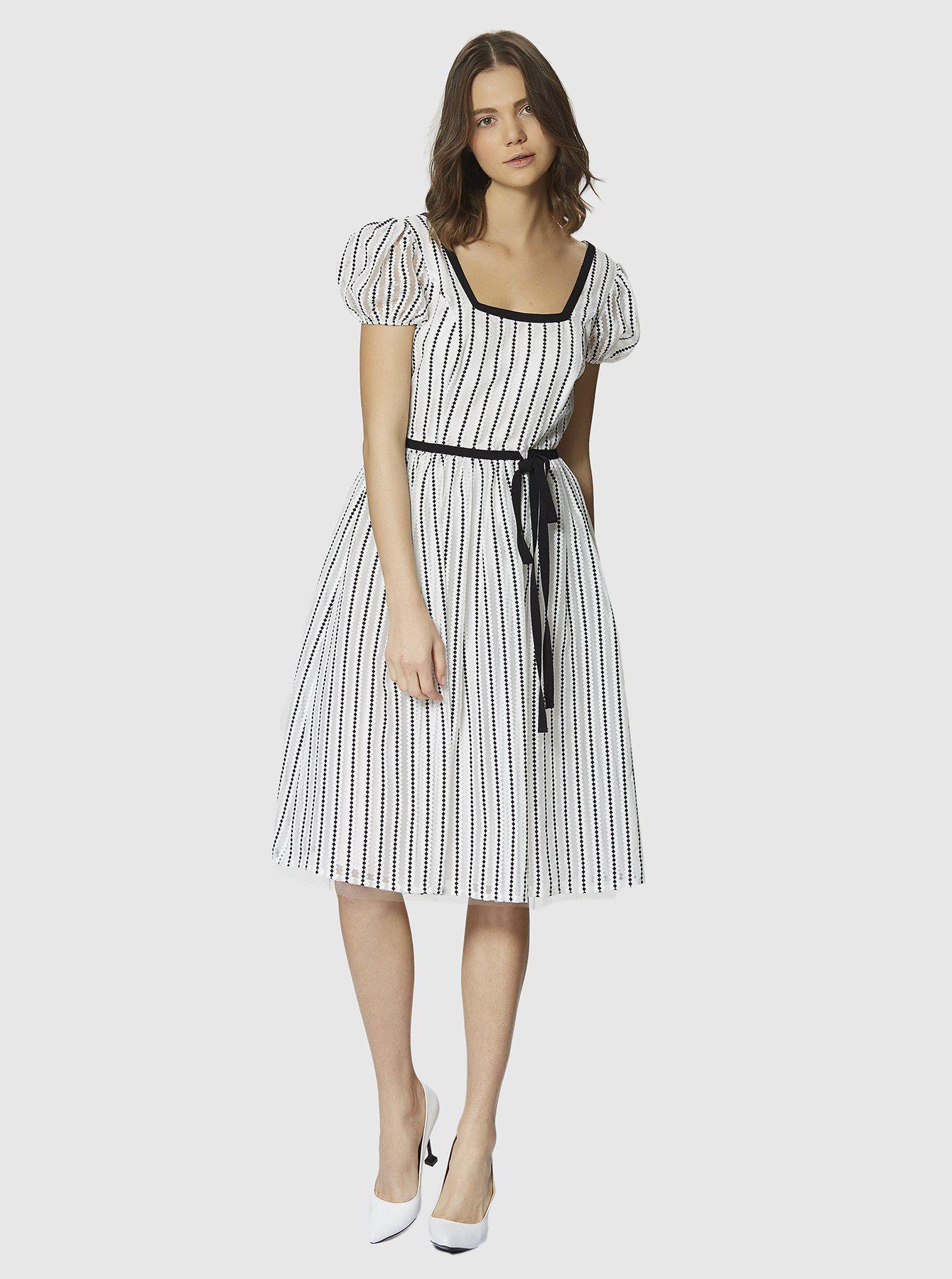 roman black and white dress