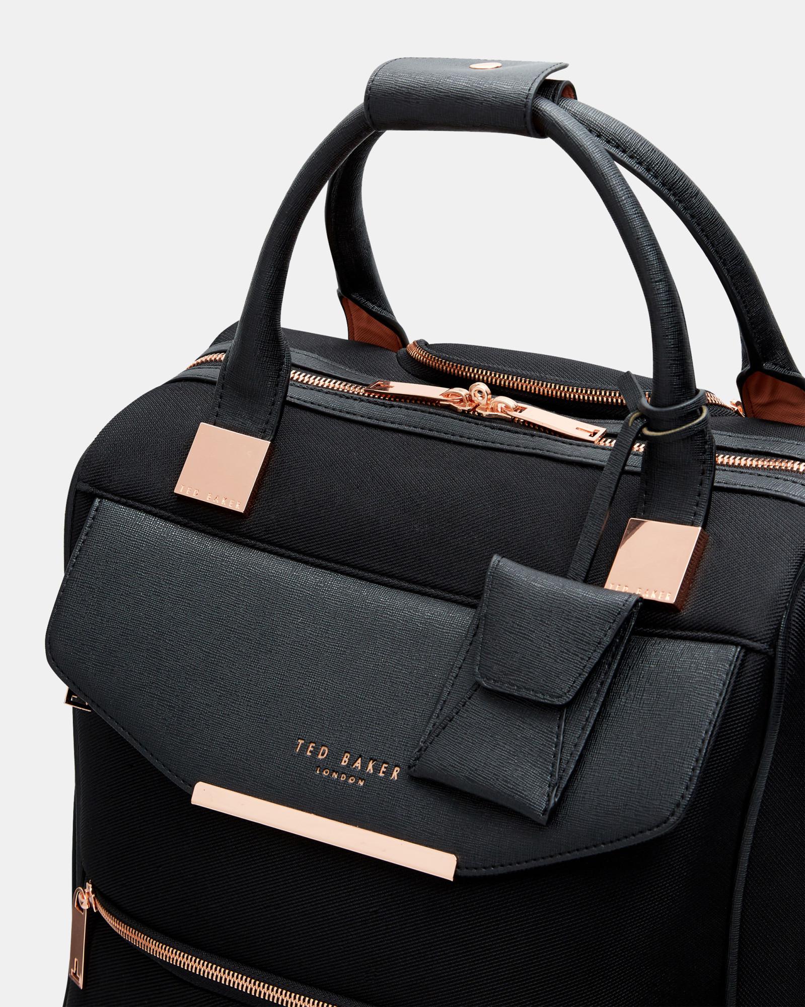 amithia metallic trim travel bag