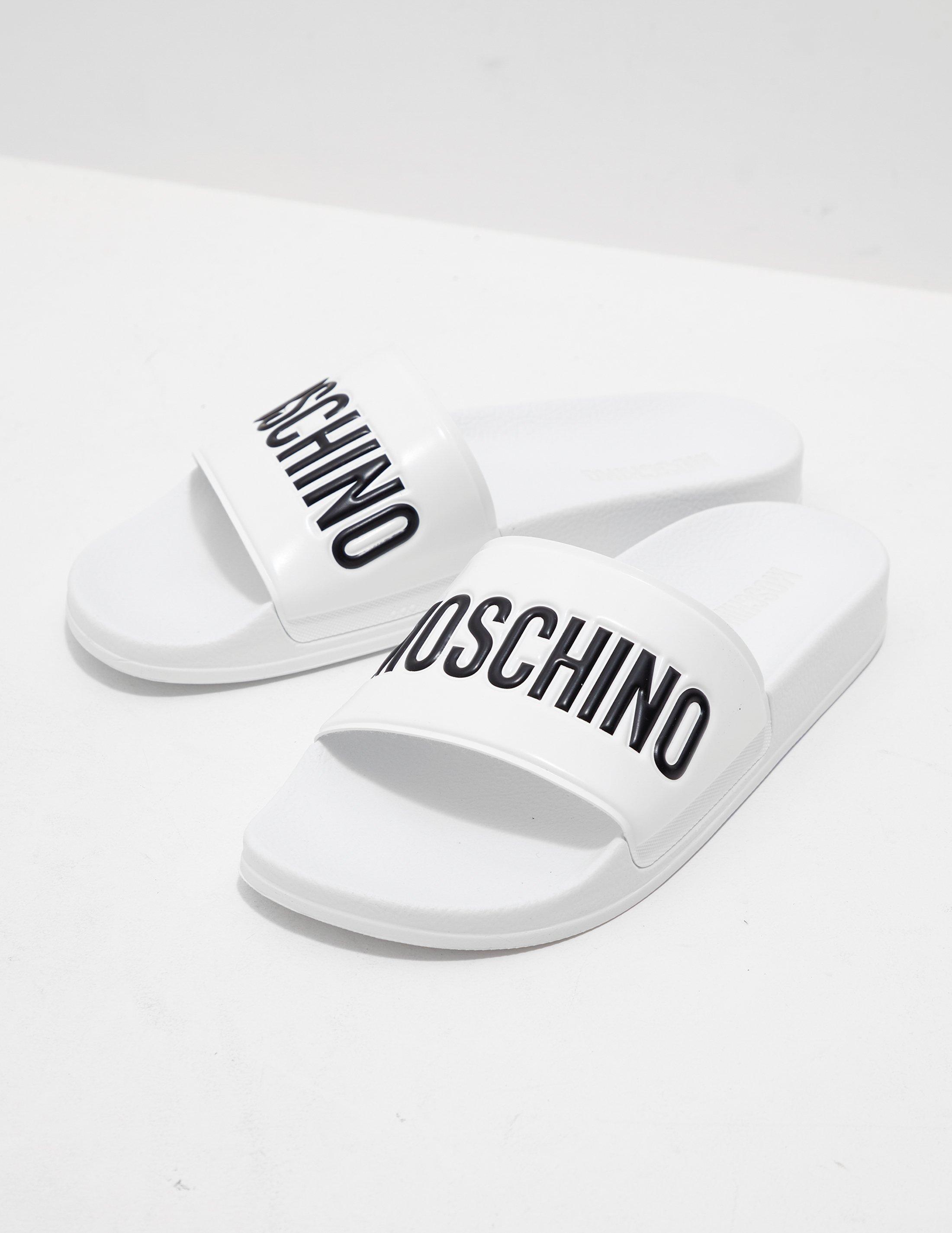 Moschino Synthetic Logo Slides in White 